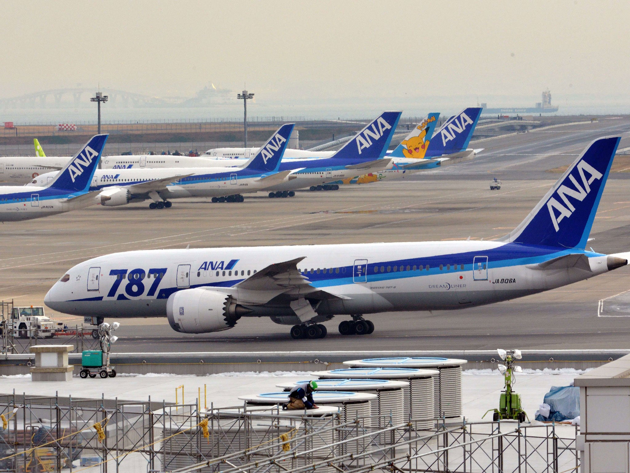 A battery beneath the cockpit of the Boeing 787 forced to make an emergency landing in Japan was swollen from overheating