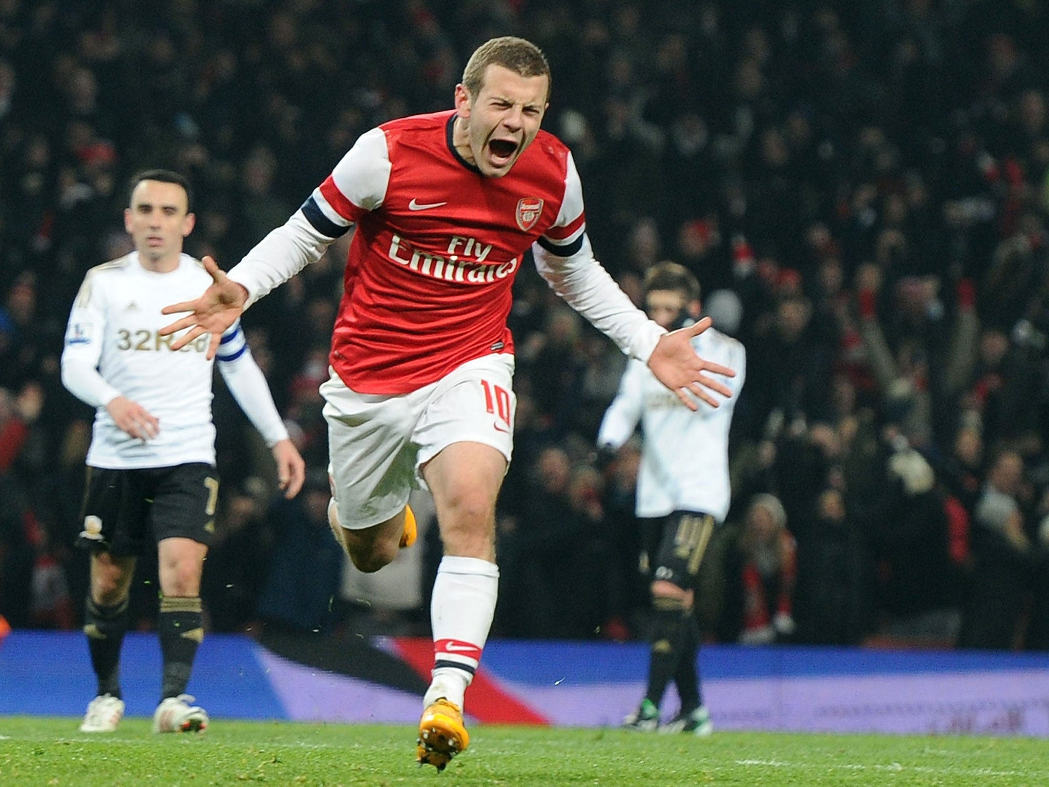 Jack Wilshere celebrates scoring against Swansea on Wednesday to complete his rehabilitation