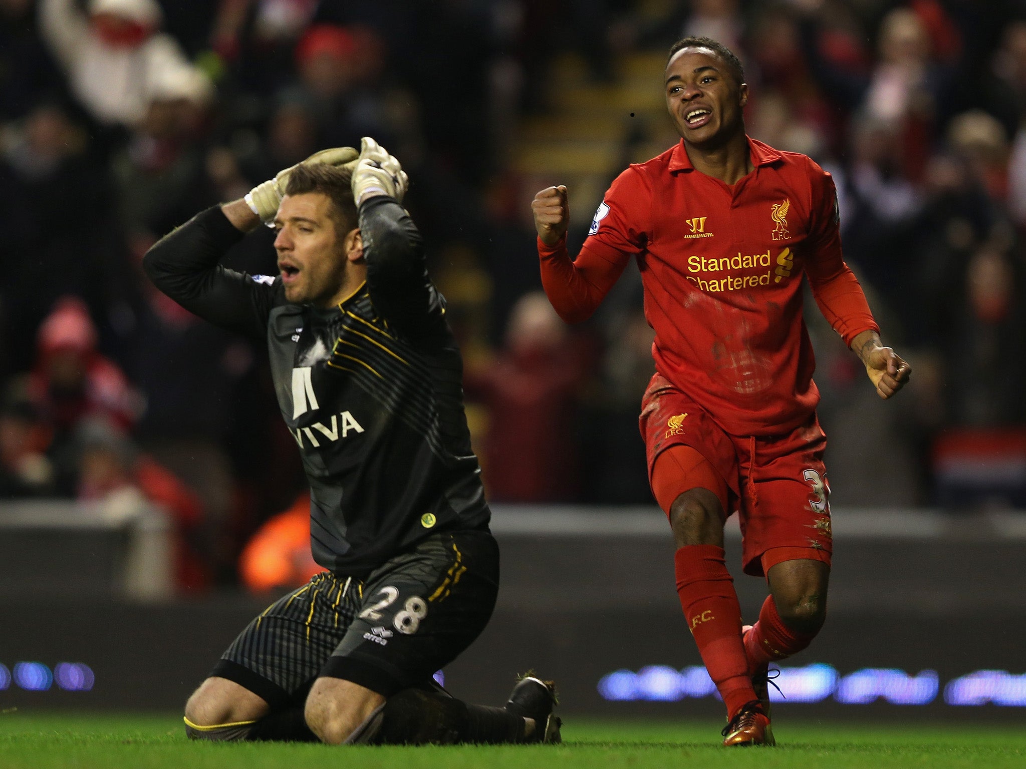 Raheem Sterling celebrates after Ryan Bennett's own goal