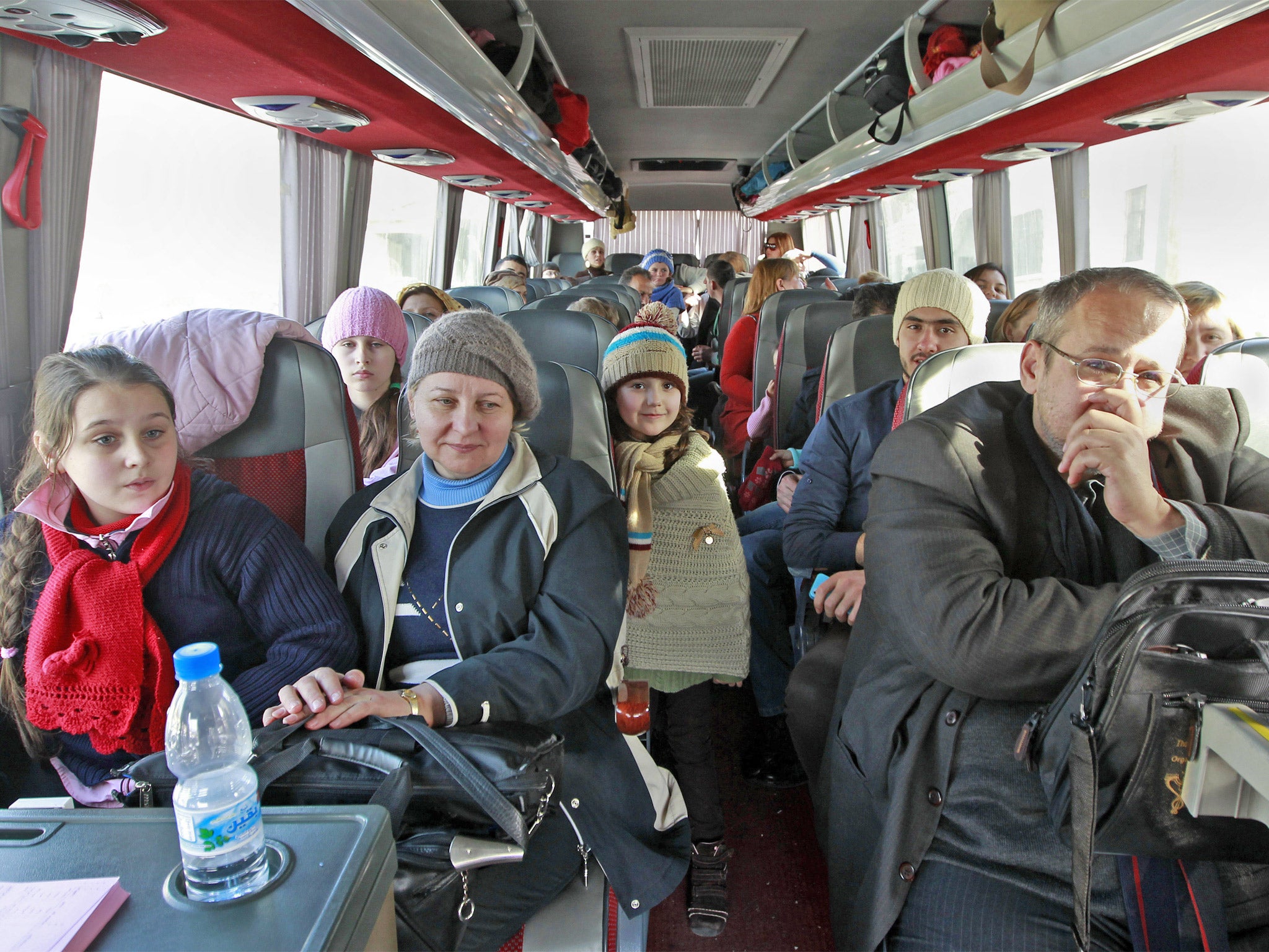 Russian citizens on board a bus shortly after crossing the border from Syria into Lebanon