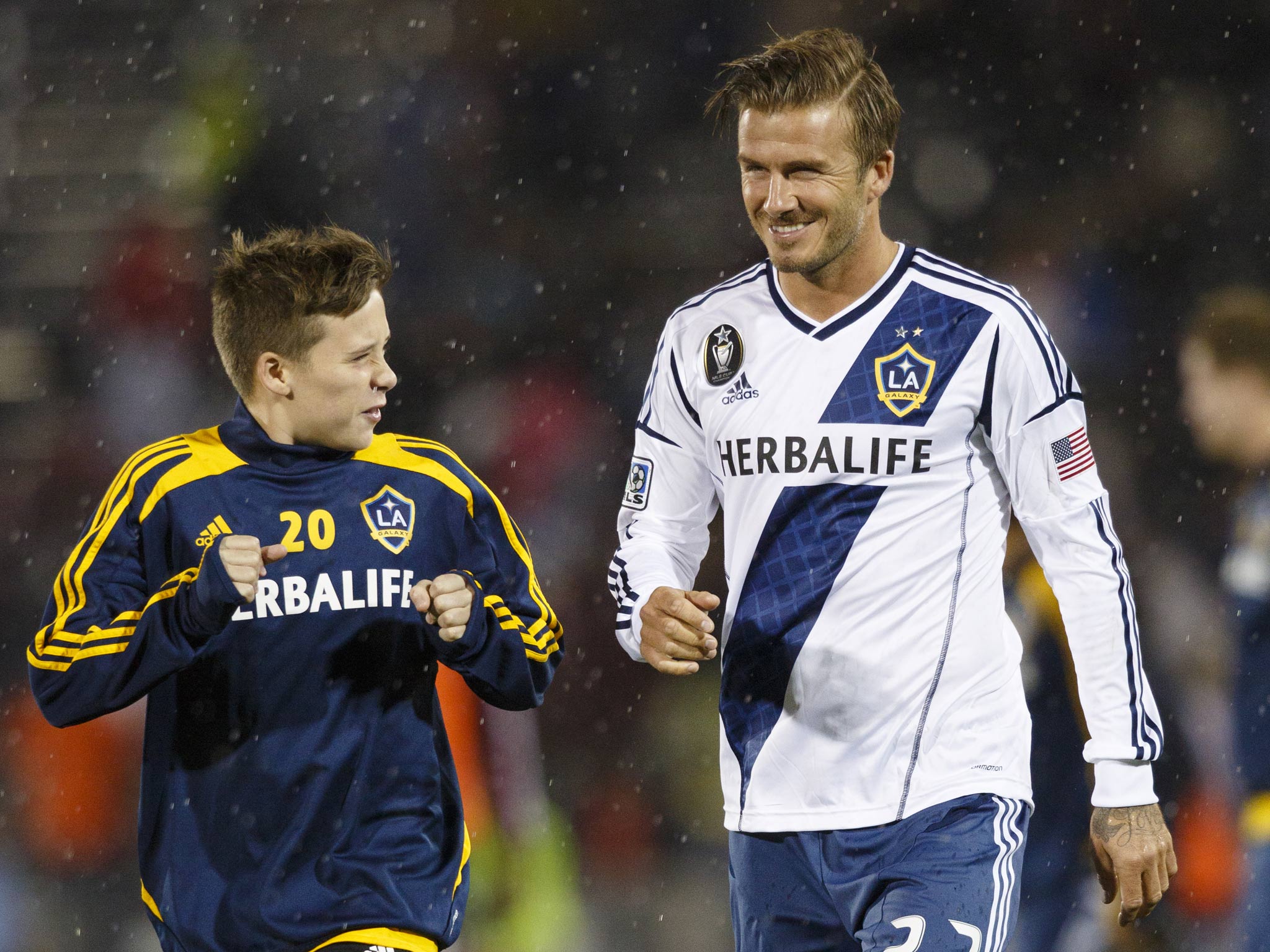 Brooklyn Beckham with his father David