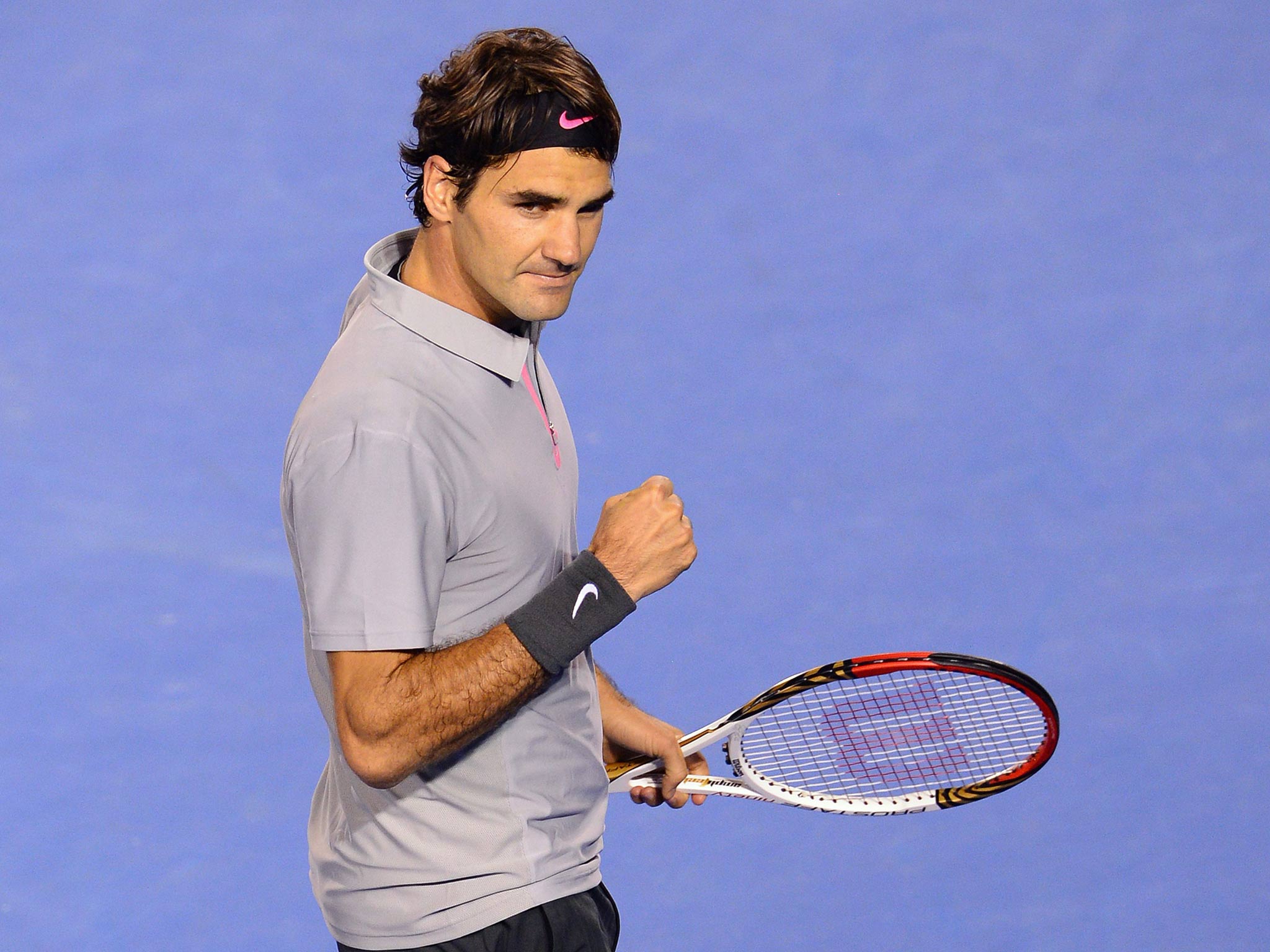 Switzerland's Roger Federer reacts after a point against France's Jo-Wilfried Tsonga during their men's singles match. Federer won over five sets