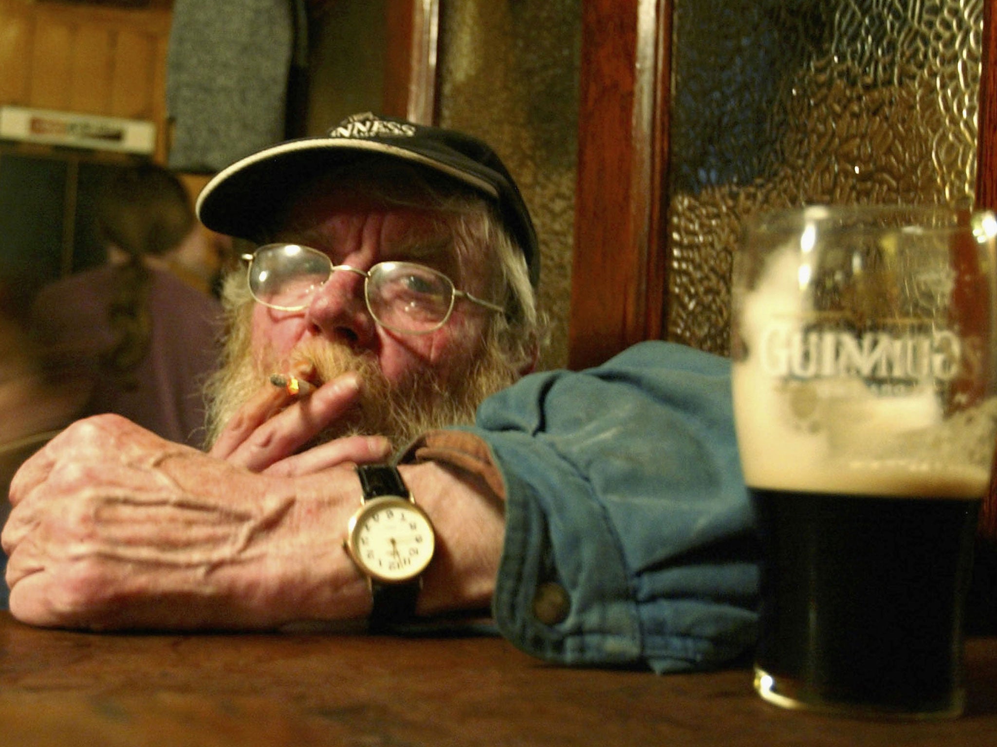 Irish smokers savour their last legal drags on cigarettes at the stroke of midnight, March 28, 2004.