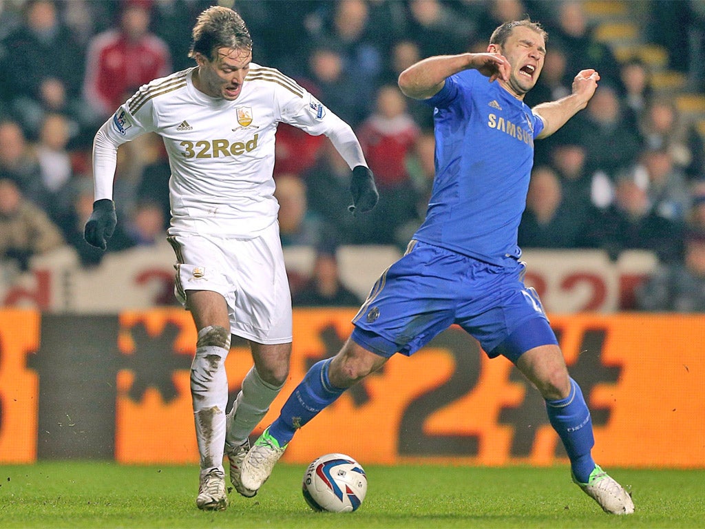 Michu (left) gets the better of Branislav Ivanovic last night