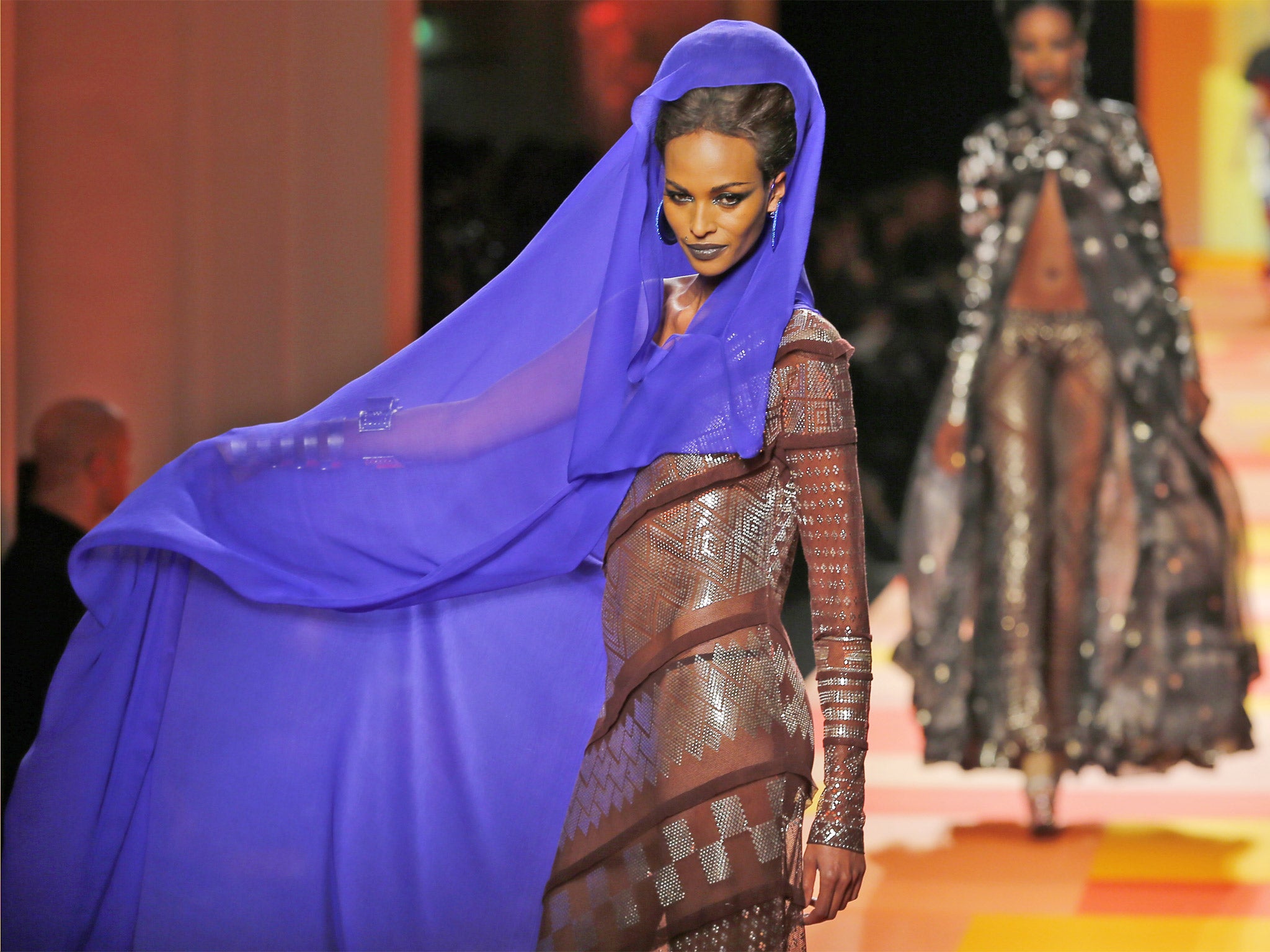A model presents a creation by French designer Jean Paul Gaultier during the Haute Couture Spring-Summer 2013 collection show