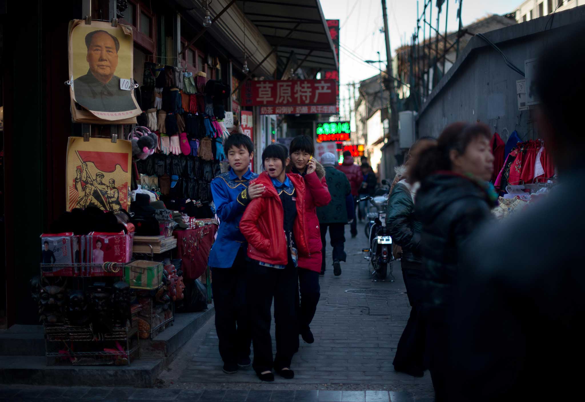 The deadly idol: a poster of Mao in a street in Qianmen, Beijing