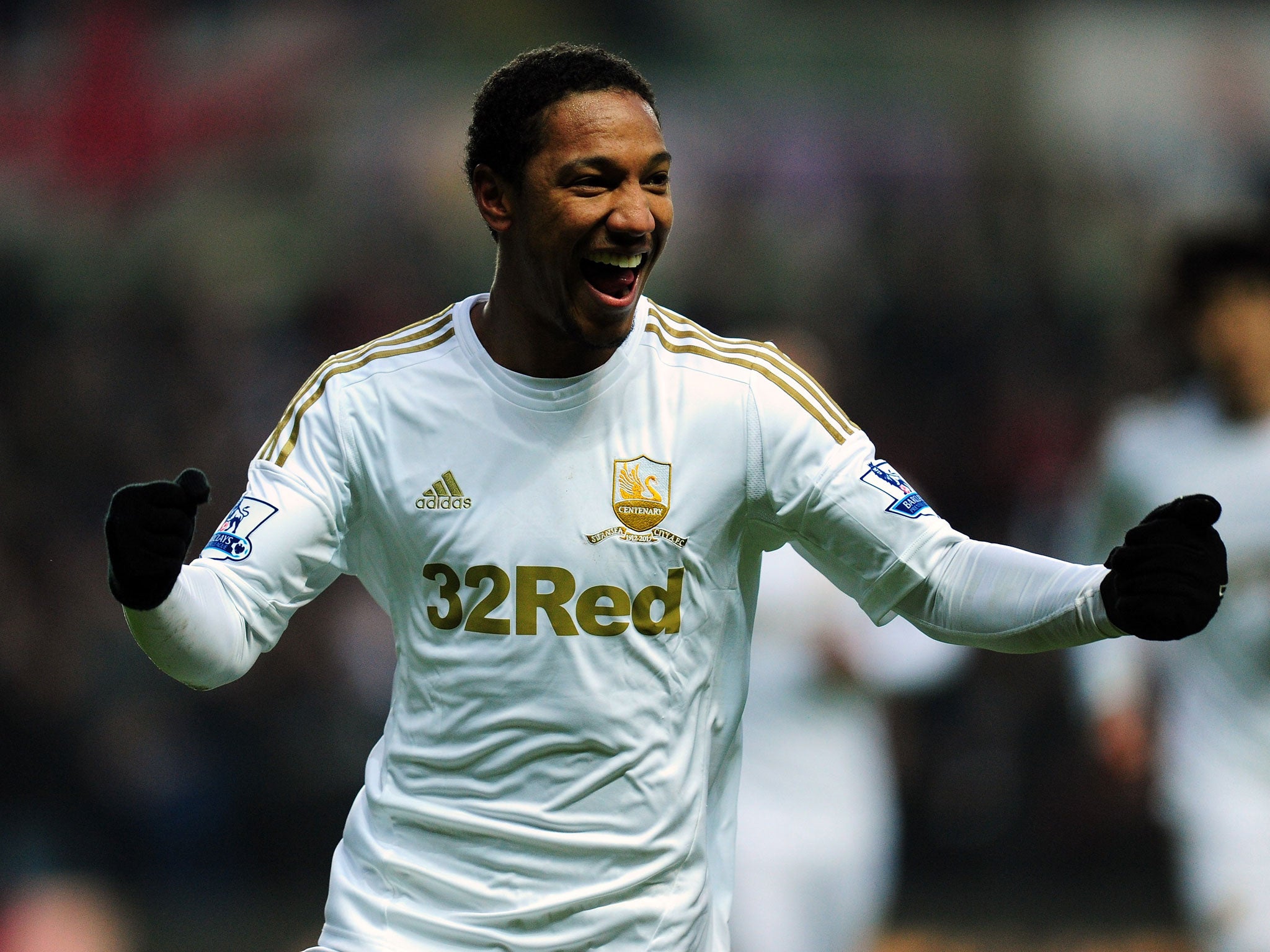 Swansea player Jonathan de Guzman celebrates after his free kick went in