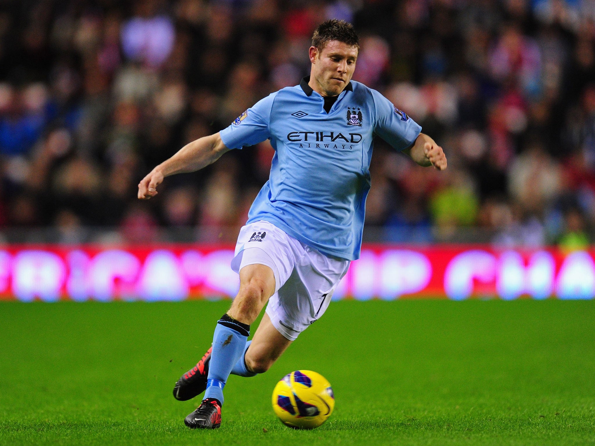 Manchester City winger James Milner in action