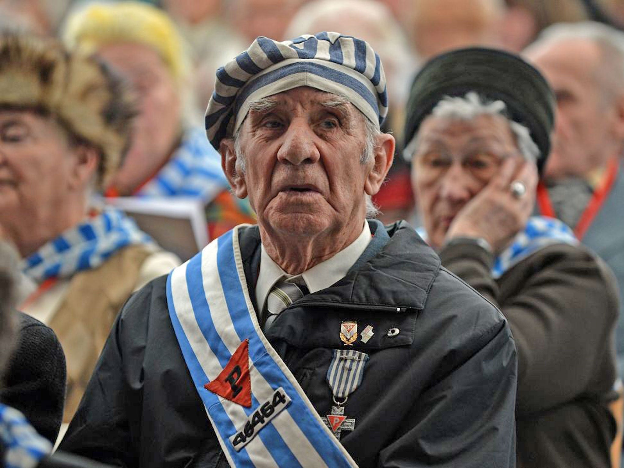Former concentration camp prisoners attend a ceremony at the memorial site of the former Nazi concentration camp Auschwitz-Birkenau in Oswiecim, Poland, on Holocaust Day