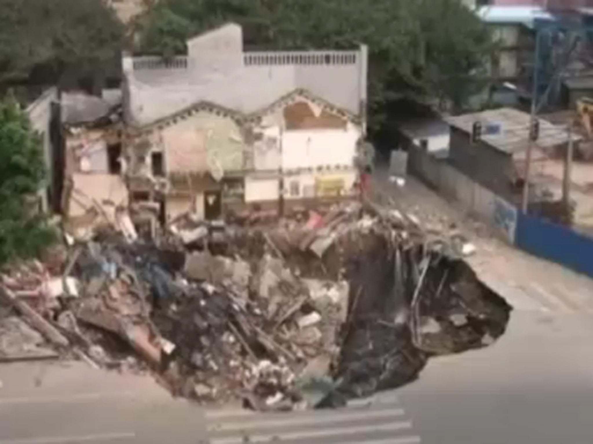 Complete destruction as the building complex is swallowed into the ground