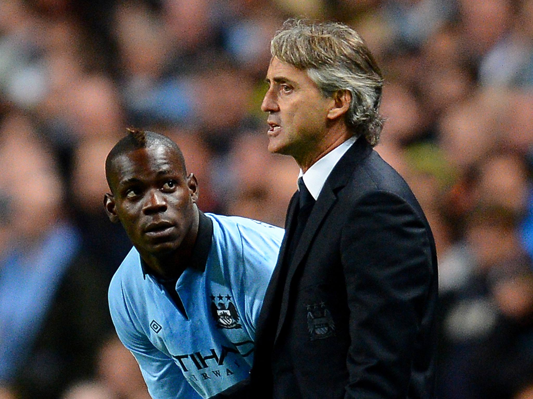 Mario Balotelli with Roberto Mancini while at Manchester City