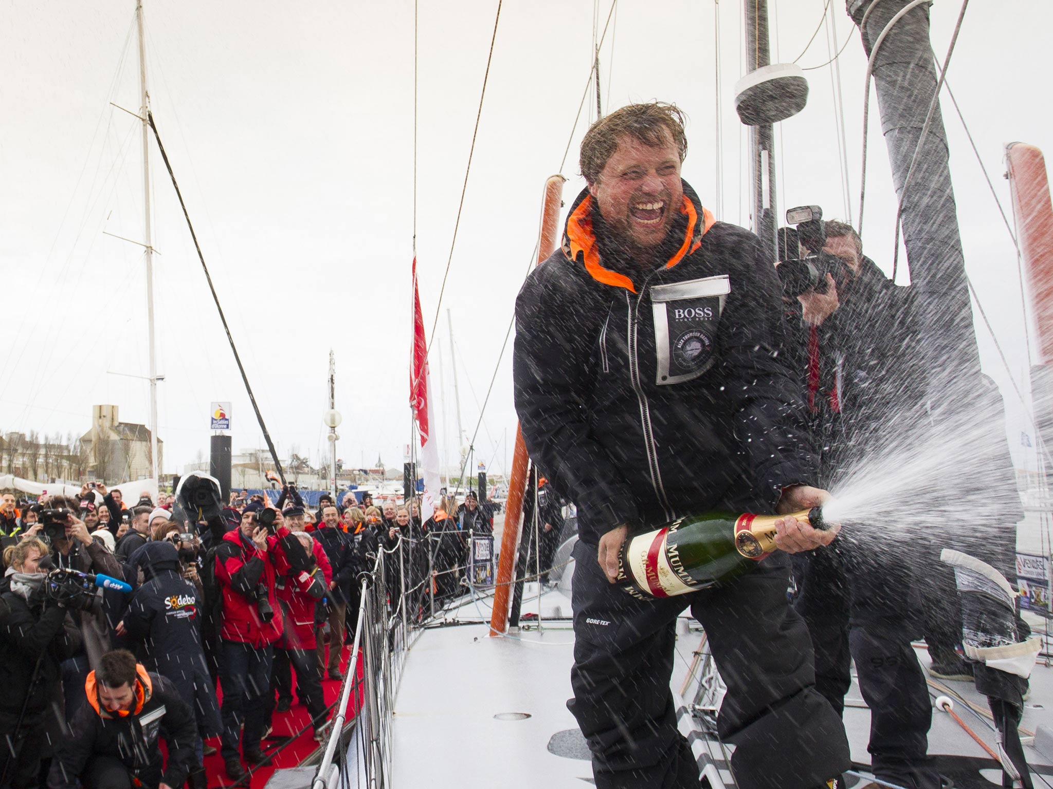 Alex Thomson celebrates third place in the Vendée Globe singlehanded round the world race. He saved enough for an early morning swig in Les Sables d’Olonne