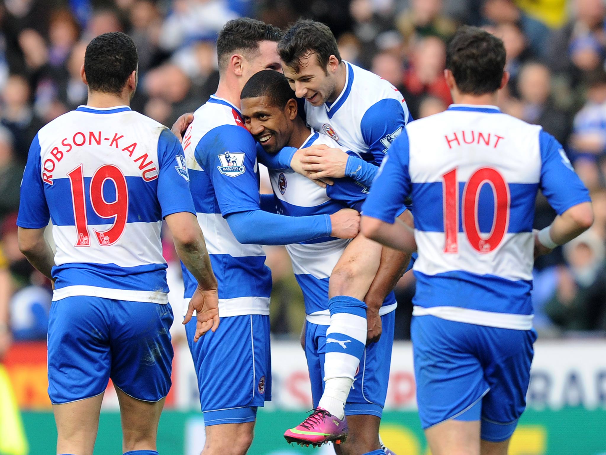 Mikele Leigertwood of Reading celebrates with team mates during the FA Cup