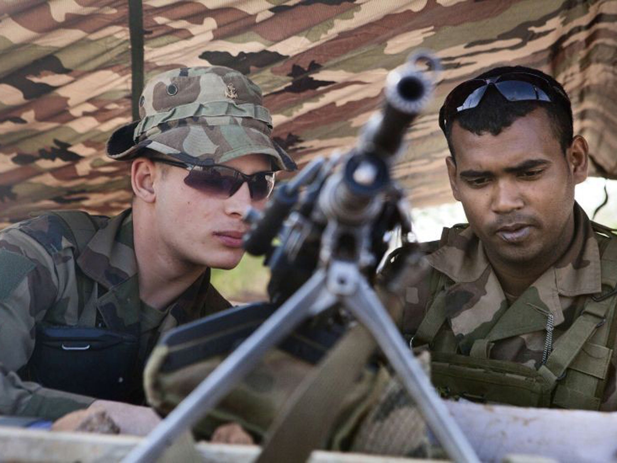 French soldiers man a checkpoint at the French controlled area of the Bamako airport