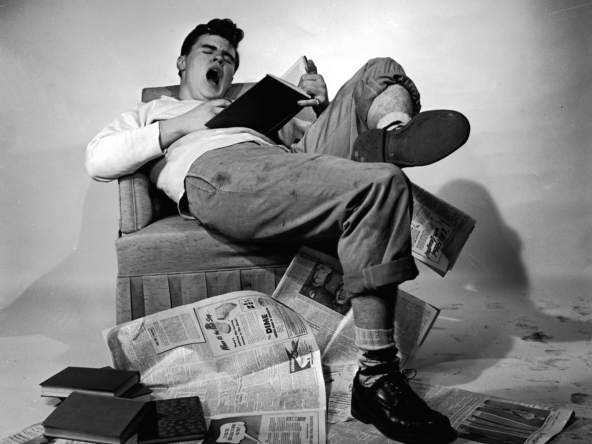 circa 1955: A student slouching in his chair