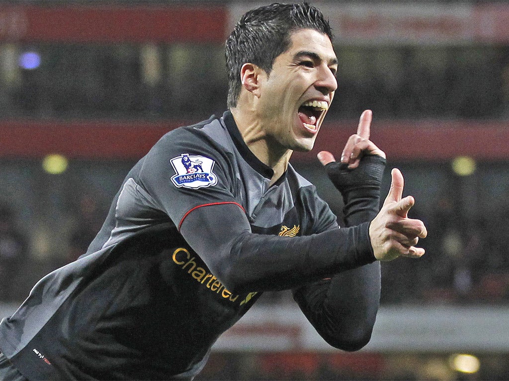 Luis Suarez celebrates scoring Liverpool's first goal