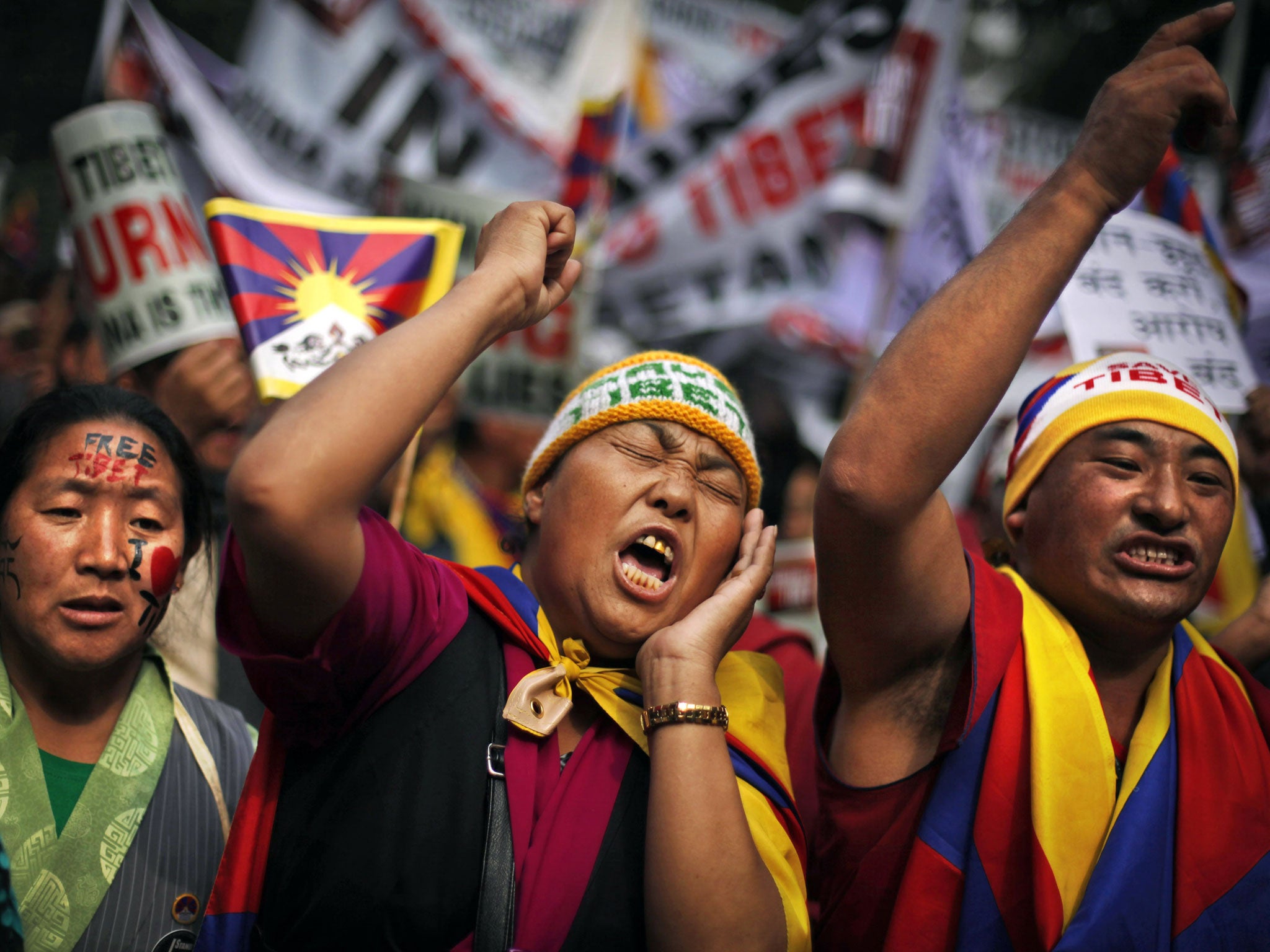 Exiled Tibetans show their support at a rally in Delhi yesterday