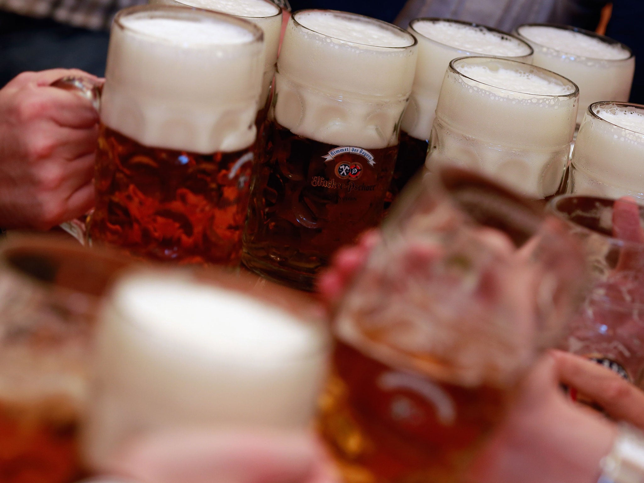 Revellers enjoy themselves as they drink beer at the Braeurosl beer tent during day 7 of Oktoberfest beer festival on September 28, 2012 in Munich, Germany