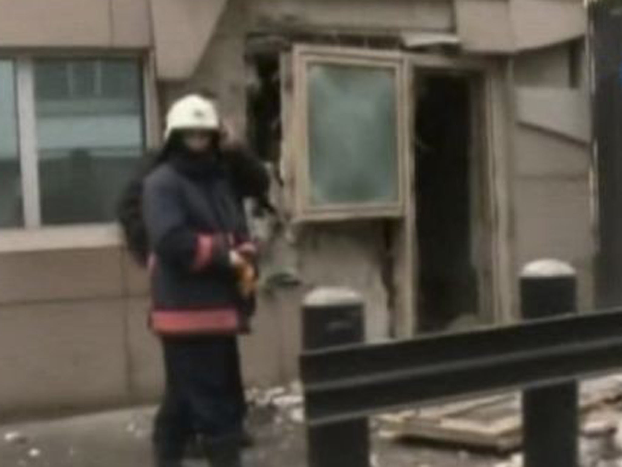 Emergency personnel are seen in front of a side entrance to the US Embassy following the blast in Ankara