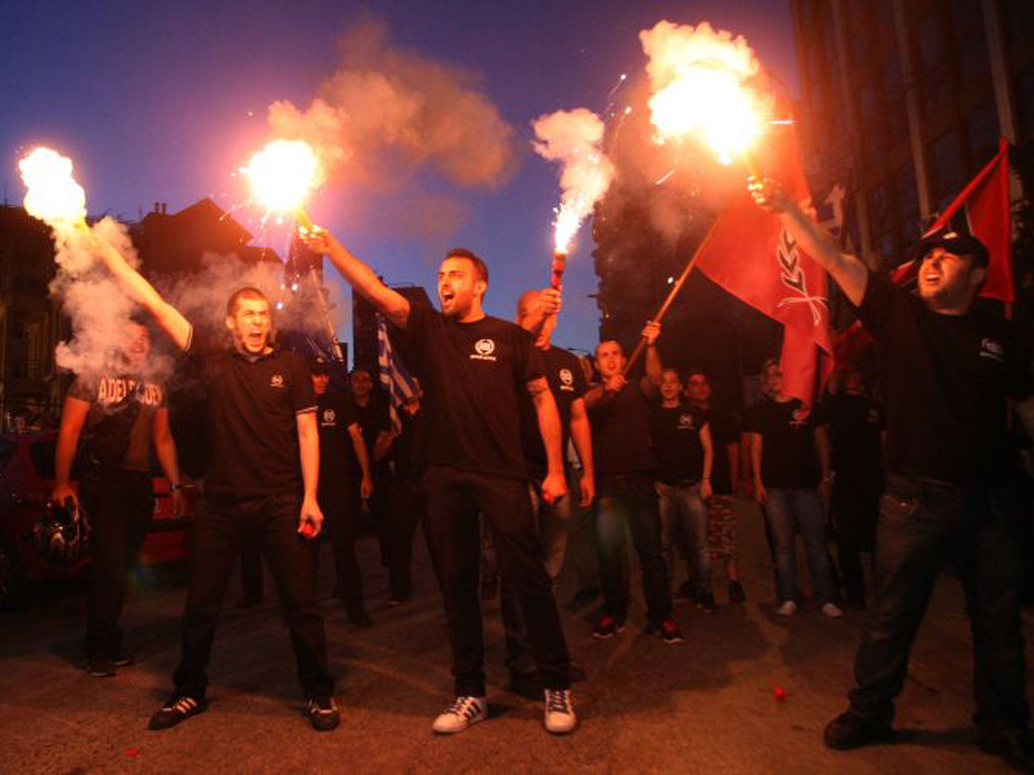 Members of Golden Dawn demonstrate in Thessaloniki; below left, Nikiforos, 12, pictured with his mother, worries that racial divisions are seeping into the classroom