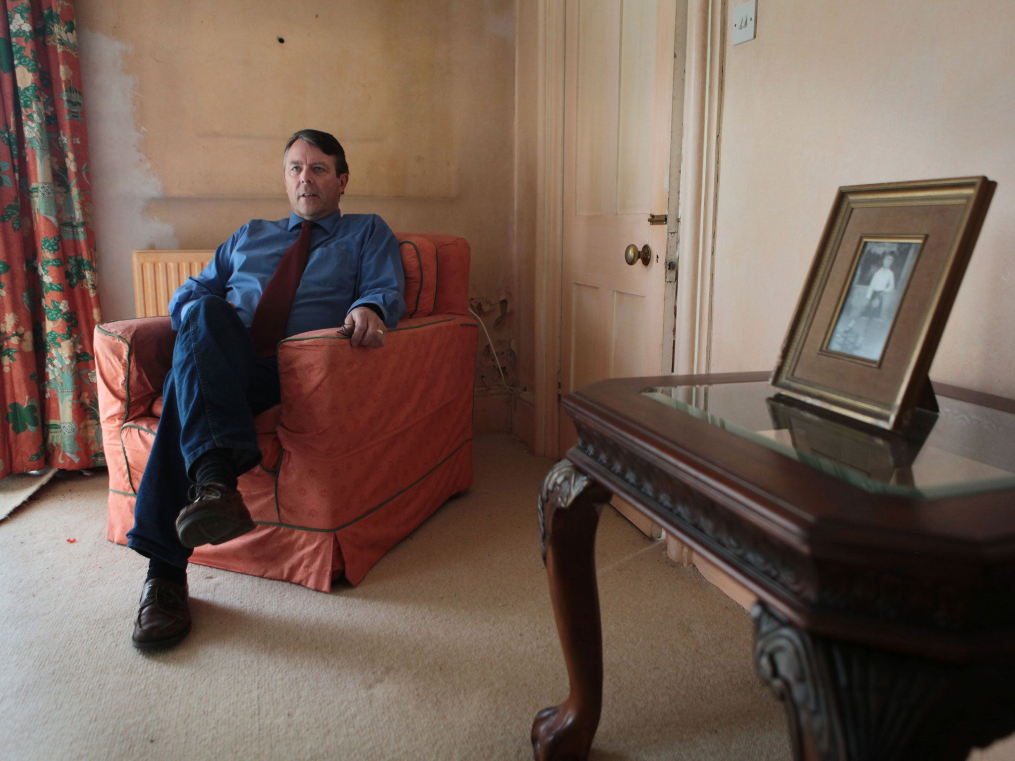 Frozen out: The earl in the unheated room where his family portraits once hung