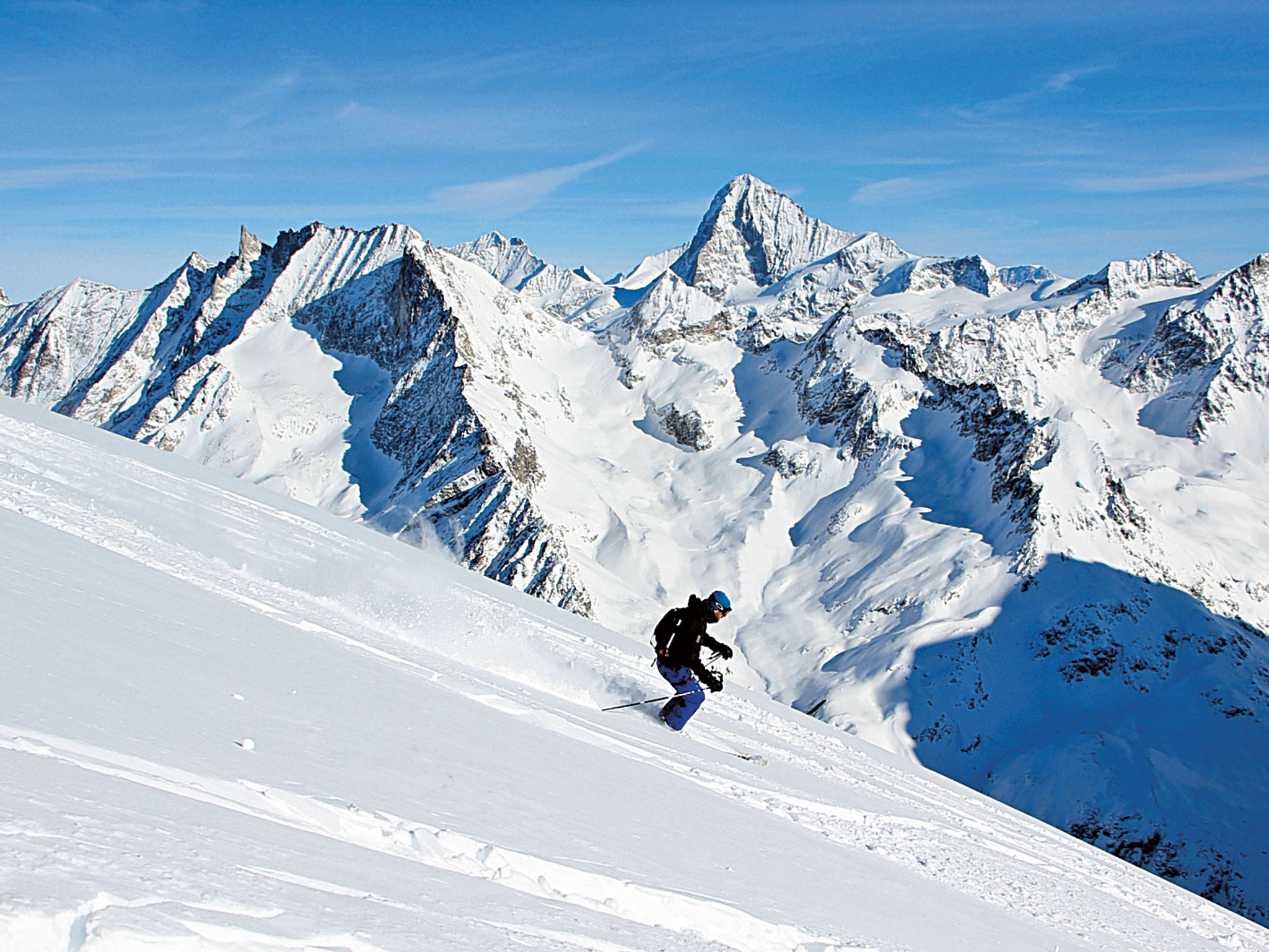 It's downhill from here: Simon skiing from the summit of the Pigne d’Arolla, accessed via a 10-minute helicopter ride from Grimentz