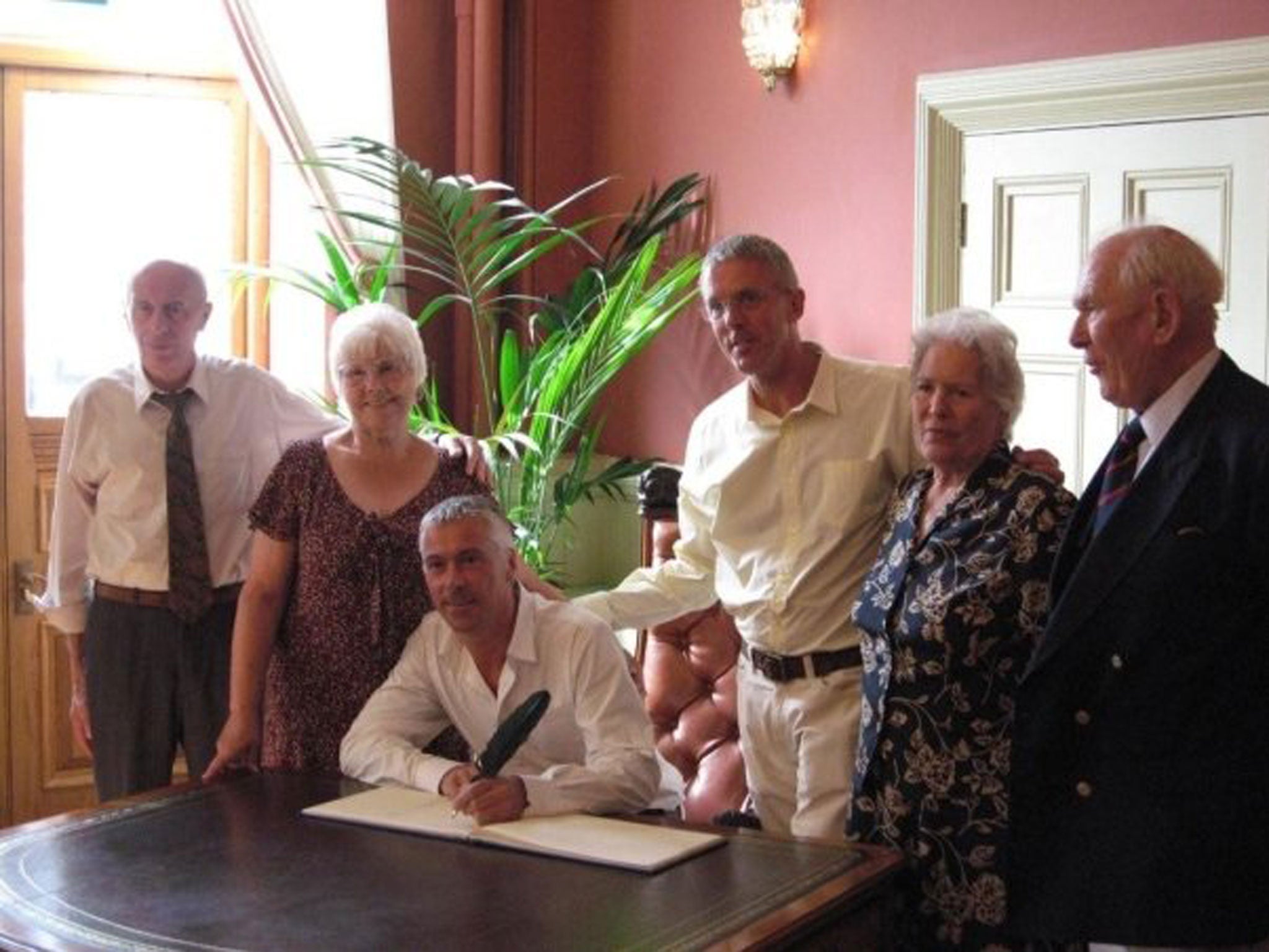 Lance Price and his partner James celebrate their civil partnership in 2008, surrounded by friends and family.