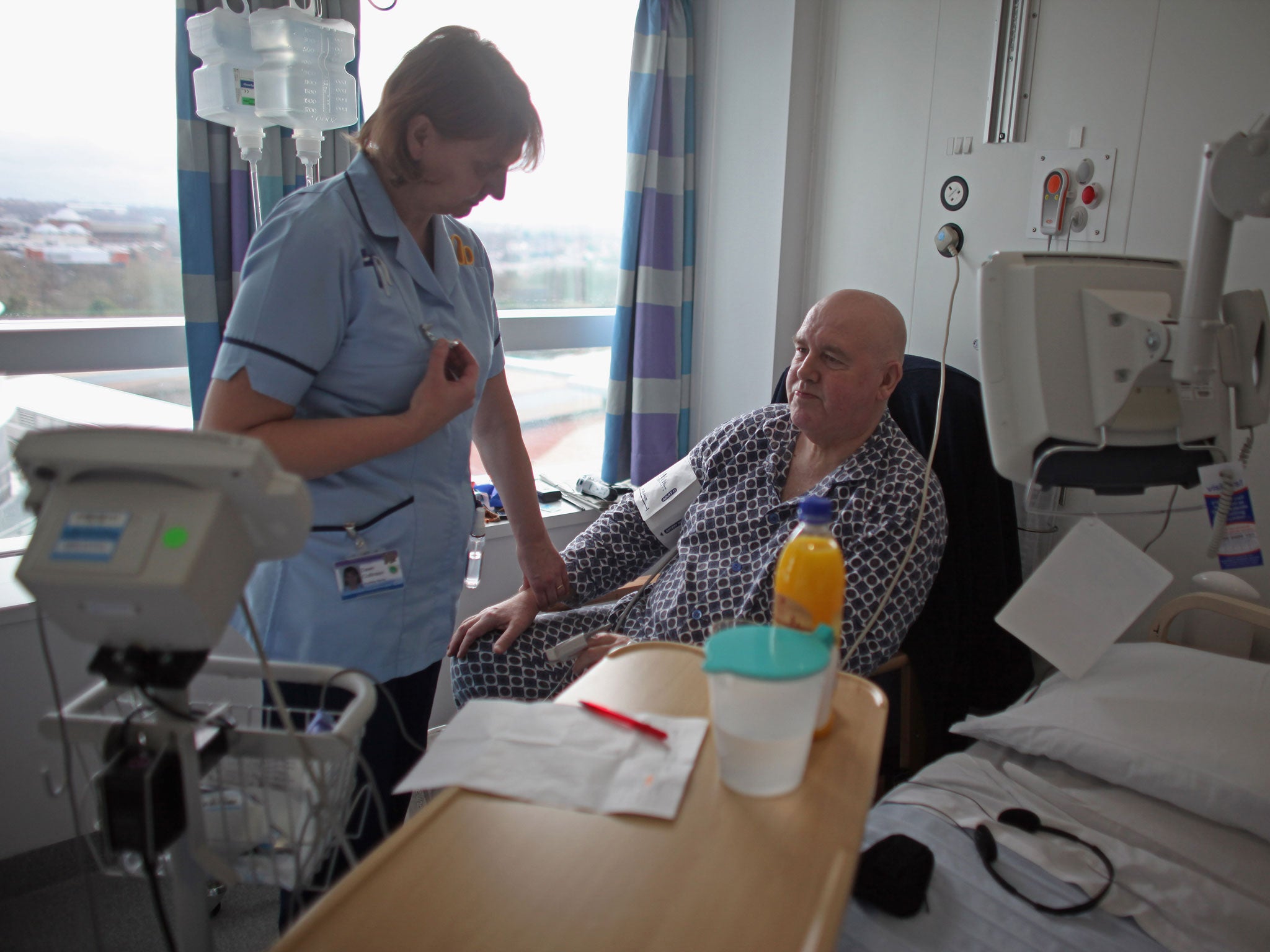 A nurse tends to a patient in the recently opened Birmingham Queen Elizabeth Hospital on February 7, 2011 in Birmingham, England.