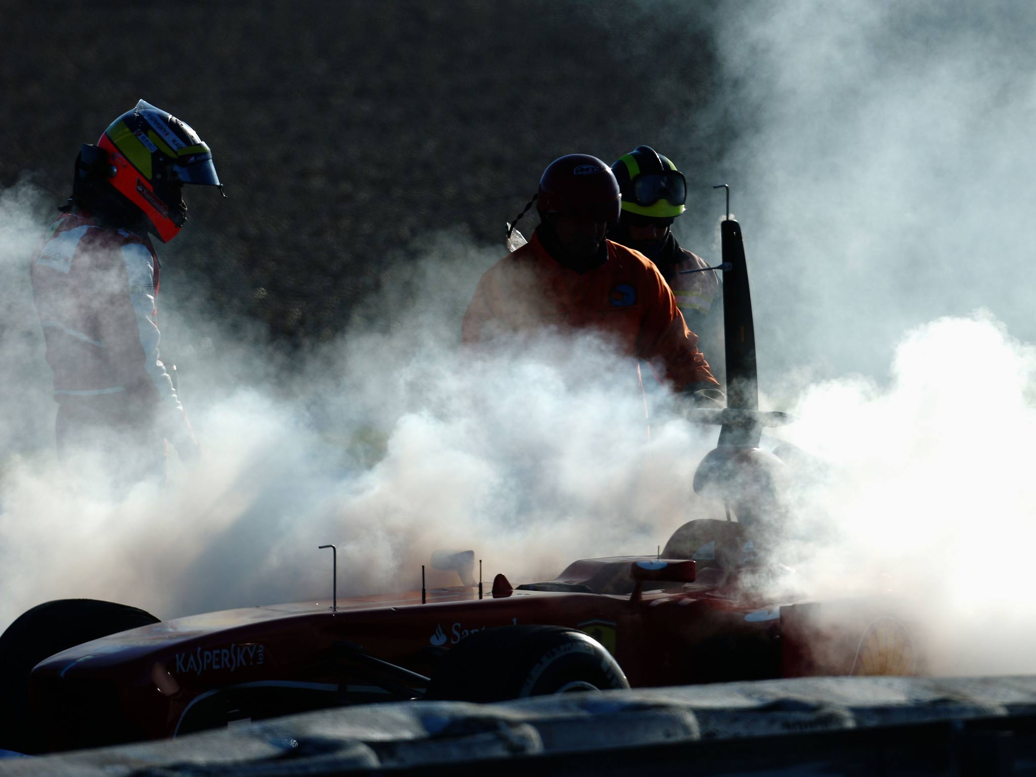 Smmoke billowsPedro de la Rosa's Ferrari