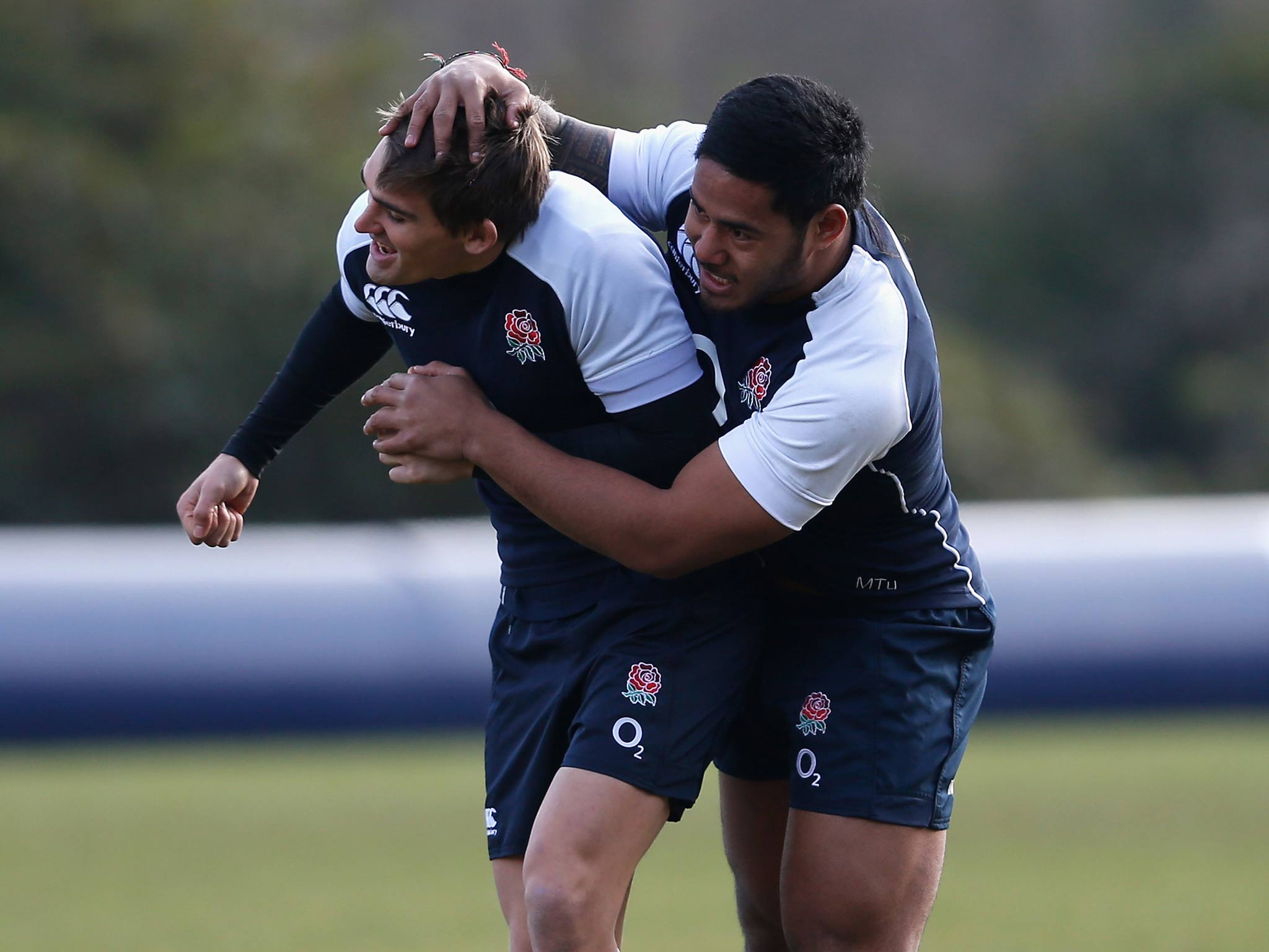 Manu Tuilagi gets to grips with Toby Flood during England training