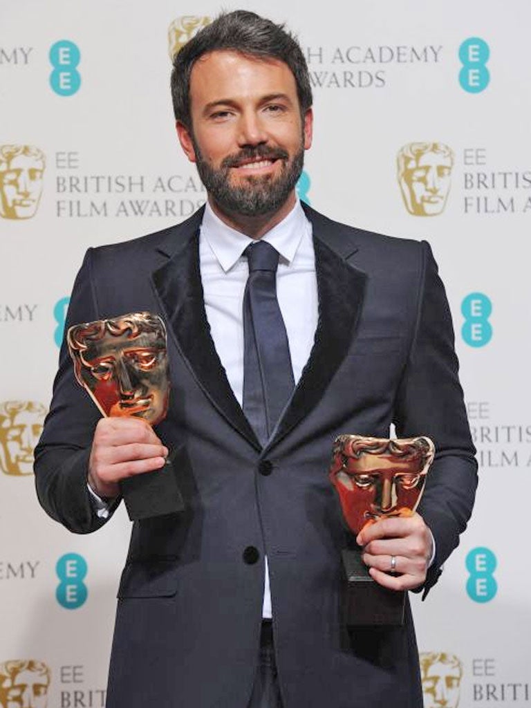 Ben Affleck poses with his Best Film and Best Director Awards at The EE British Academy Film Awards 2013 at The Royal Opera House