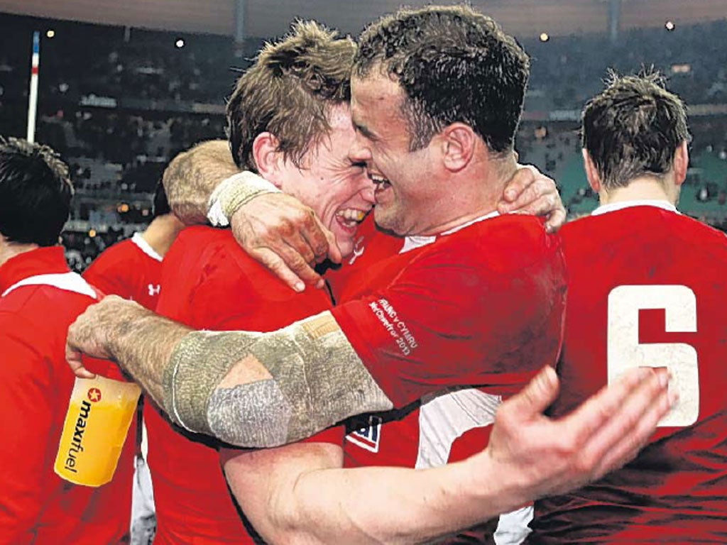 Jonathan Davies (left), of Wales, celebrates with Jamie Roberts