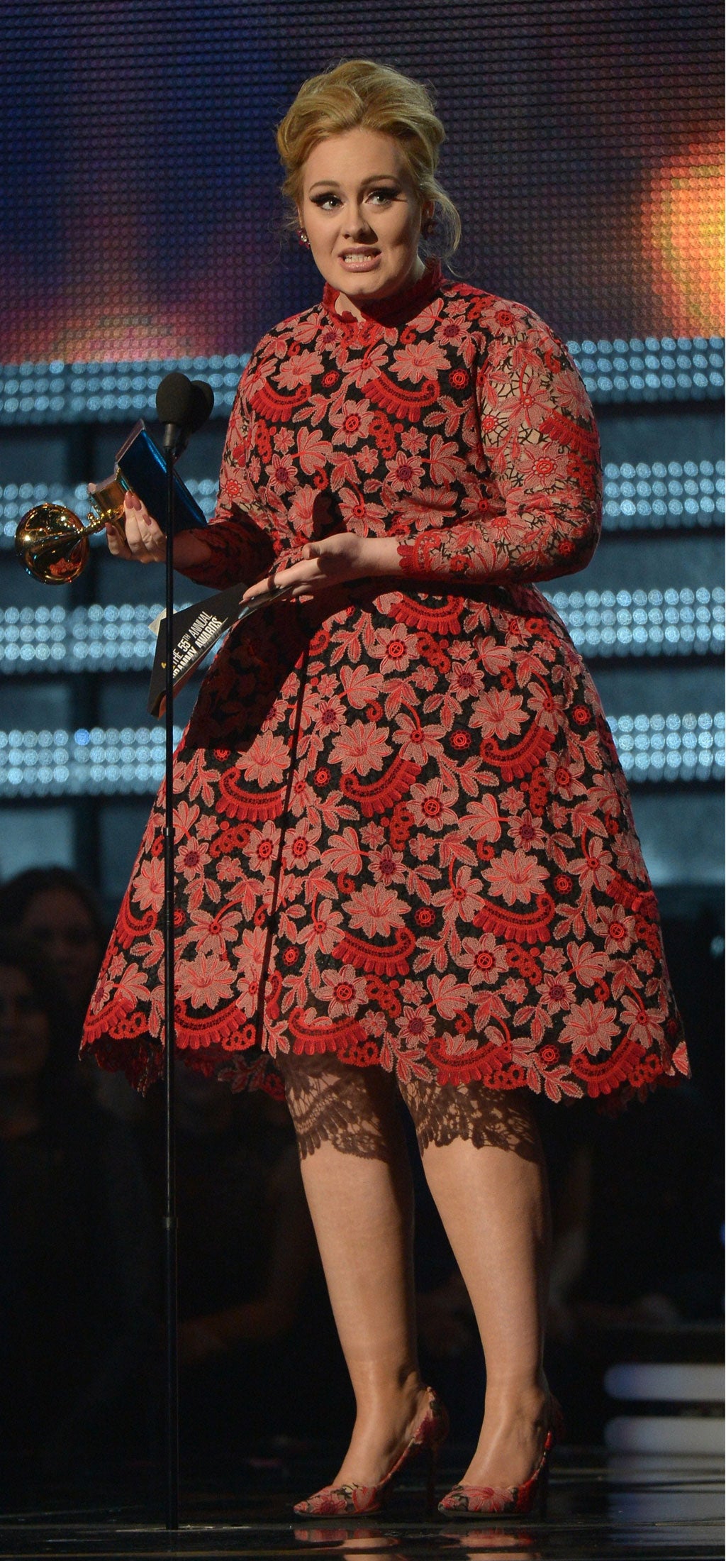 Adele receives the Grammy for best pop solo performance