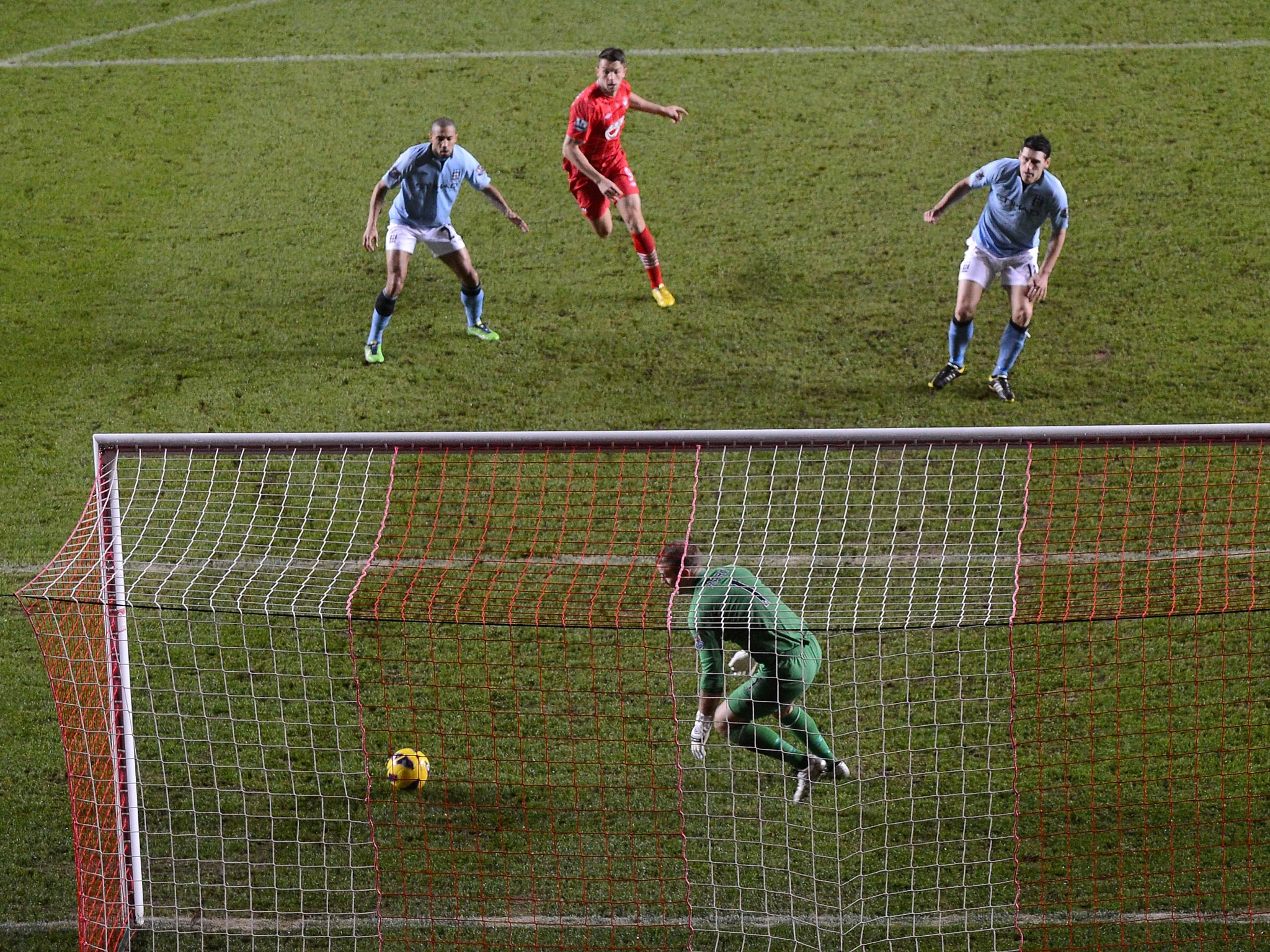 The moment Gareth Barry of Manchester City scores an own goal in the match against Southampton