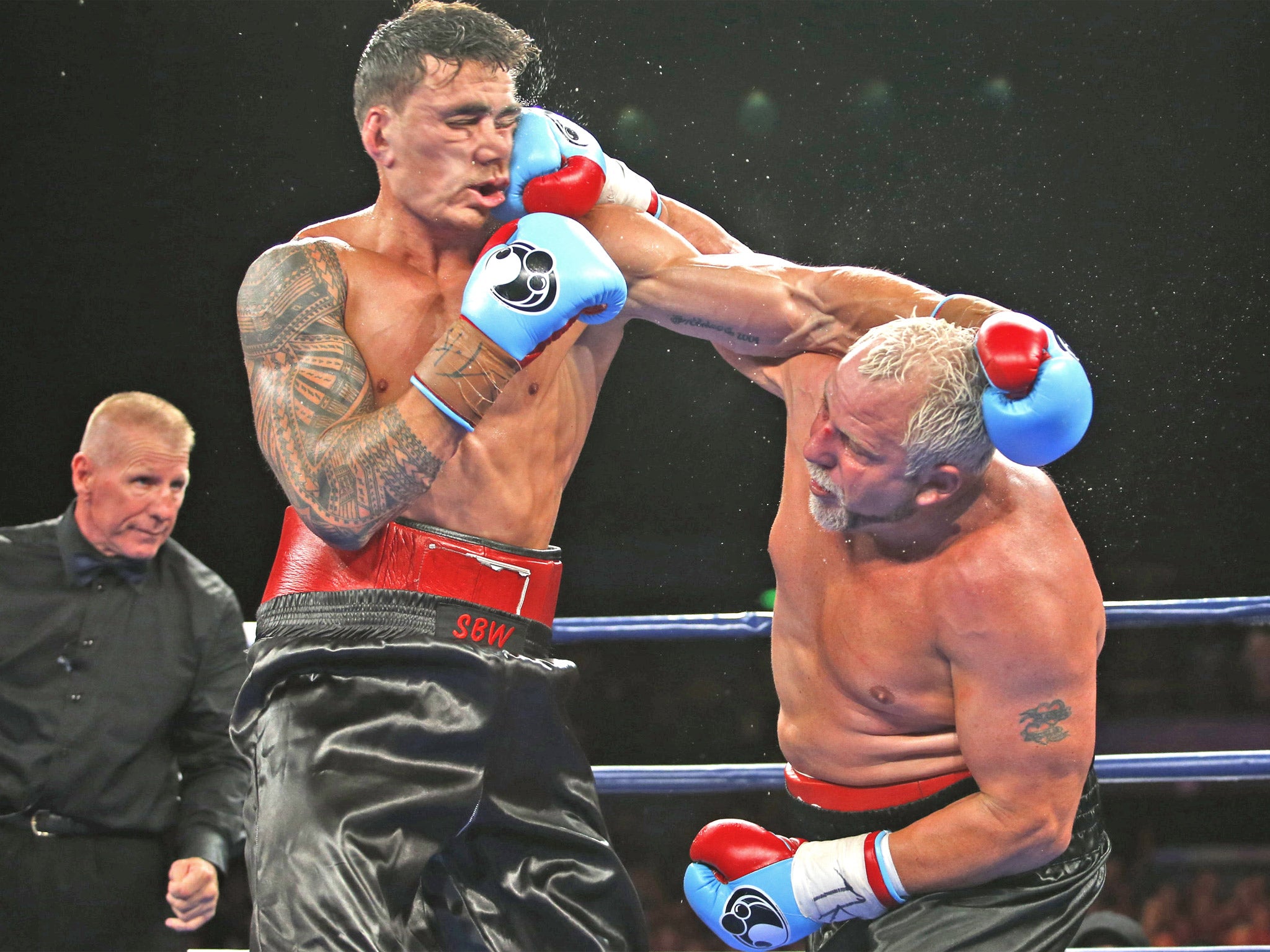 Sonny Bill Williams (left) and Frans Botha slug it out