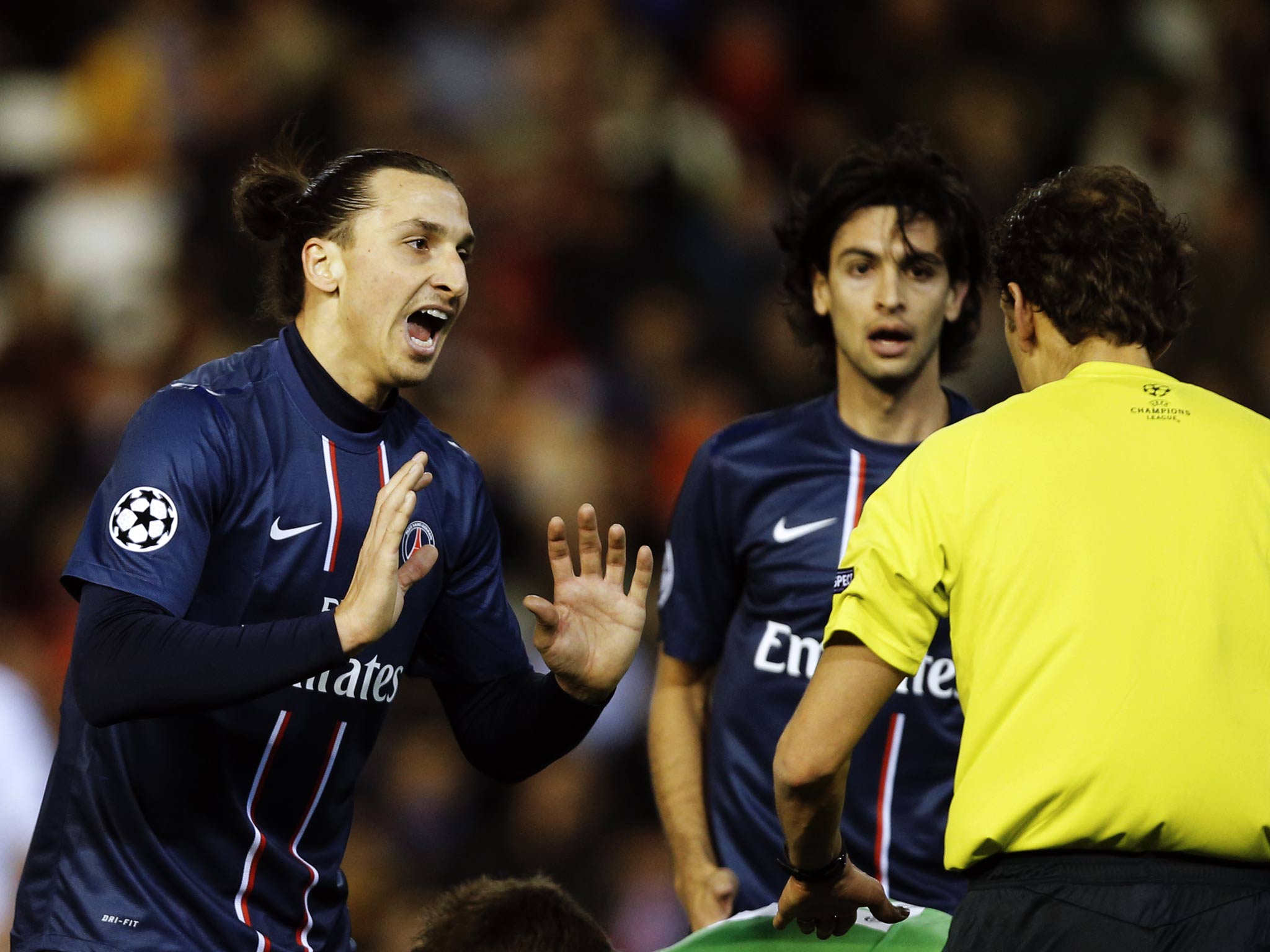 PSG striker Zlatan Ibrahimovic protests his innocence after being sent off against Valencia