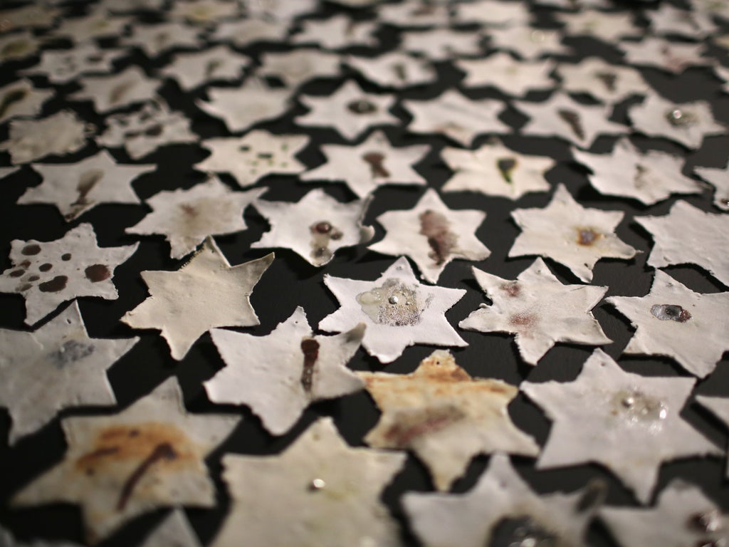 A detail from an installation by Ceramic artist Chava Rosenzweig of ceramic stars representing how the Holocaust shaped people's lives to mark Holocaust Memorial Day