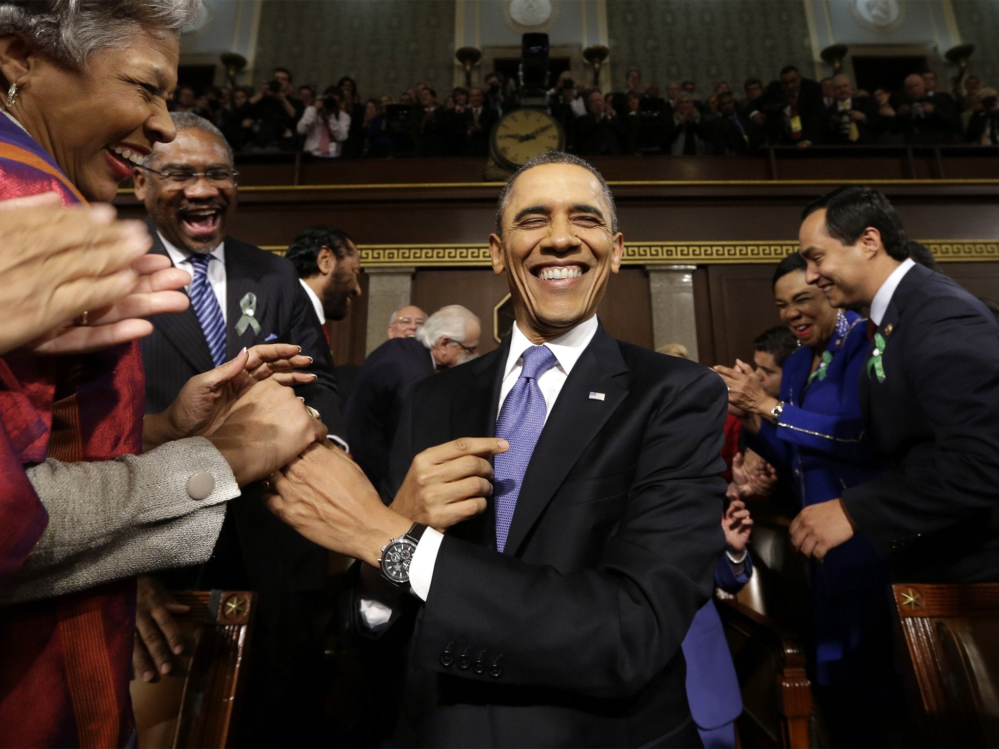 President Barack Obama is greeted before his State of the Union address