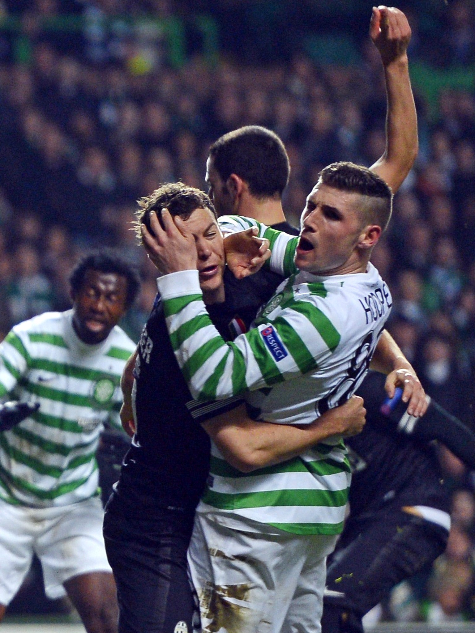 Juventus’ Stephan Lichtsteiner tussles with Gary Hooper