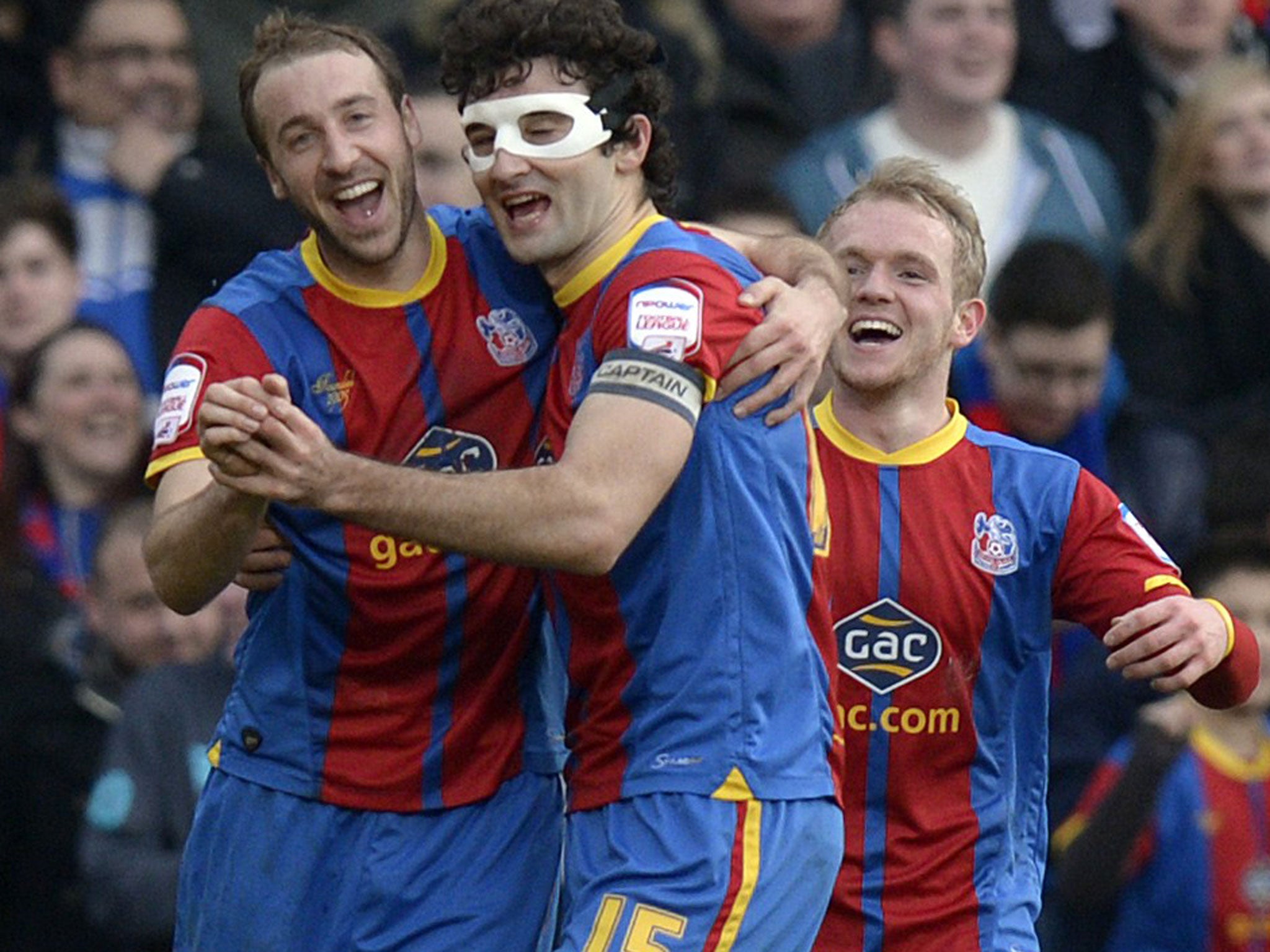 Masked ball: Glenn Murray and Mile Jedinak celebrate Palace’s goal-feast