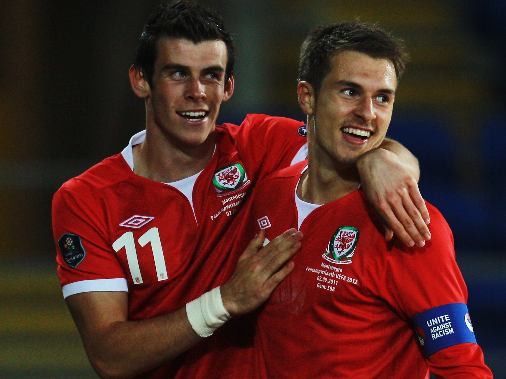 In the red: Gareth Bale (left) and Aaron Ramsey in action for Wales