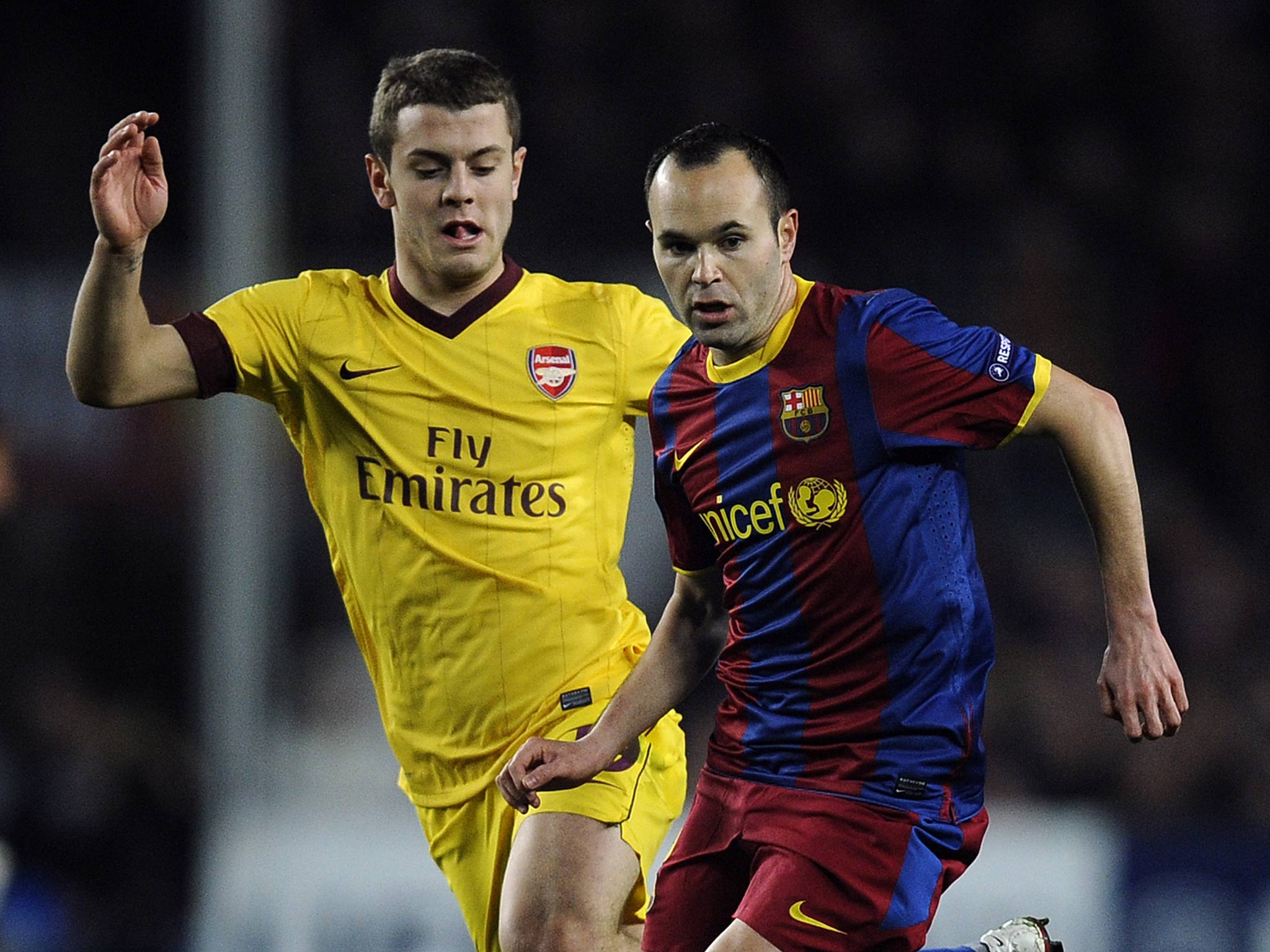 Jack Wilshere seen competing against Andre Iniesta in 2011