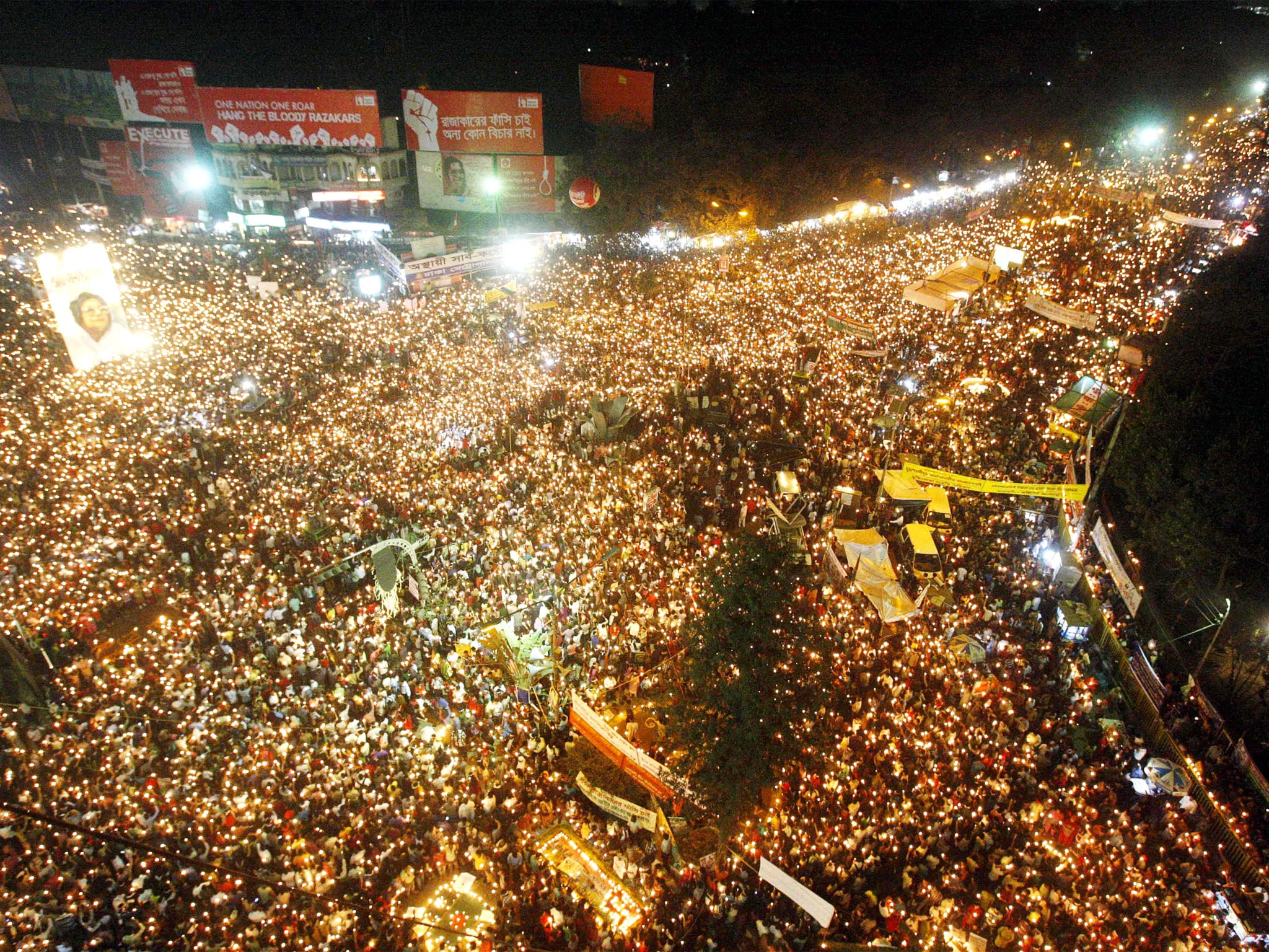 February 2013: Bangladeshi activists participate in a candlelight vigil demanding the execution of Jamaat-e-Islami leader Abdul Kader Mullah and others convicted of war crimes during the nation's independence war in 1971