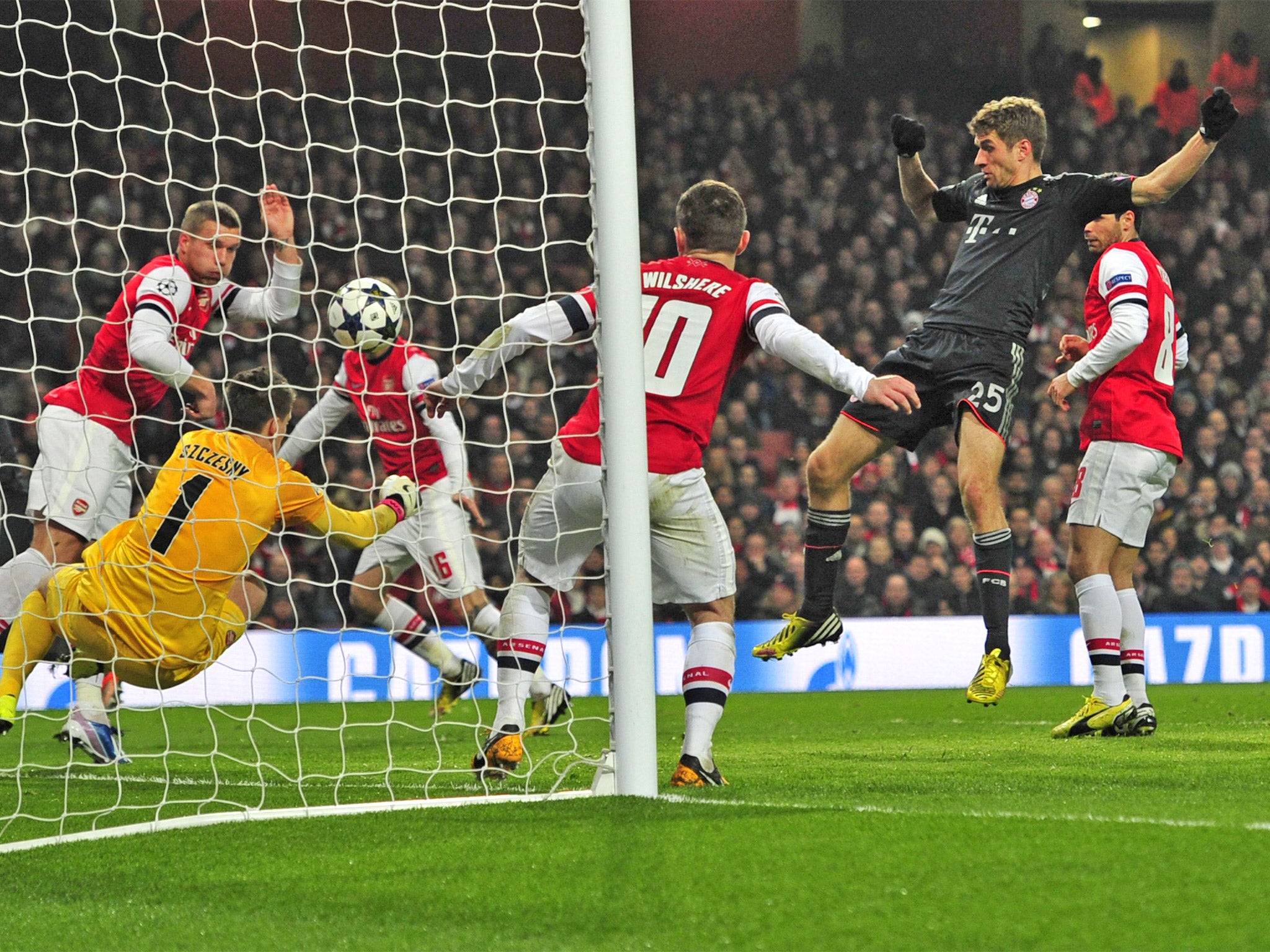 Thomas Muller pokes in Bayern’s second goal against Arsenal