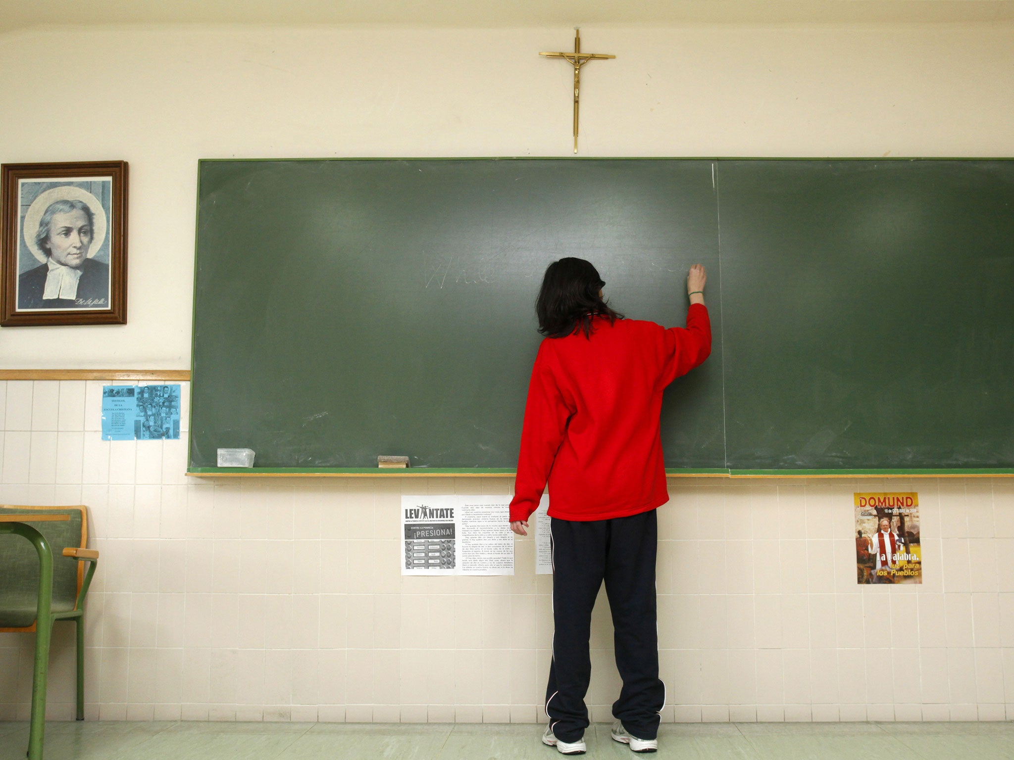 A crucifix hangs on the wall of a classroom in a school of the city of Burgos, northern Spain, on December 3, 2009.