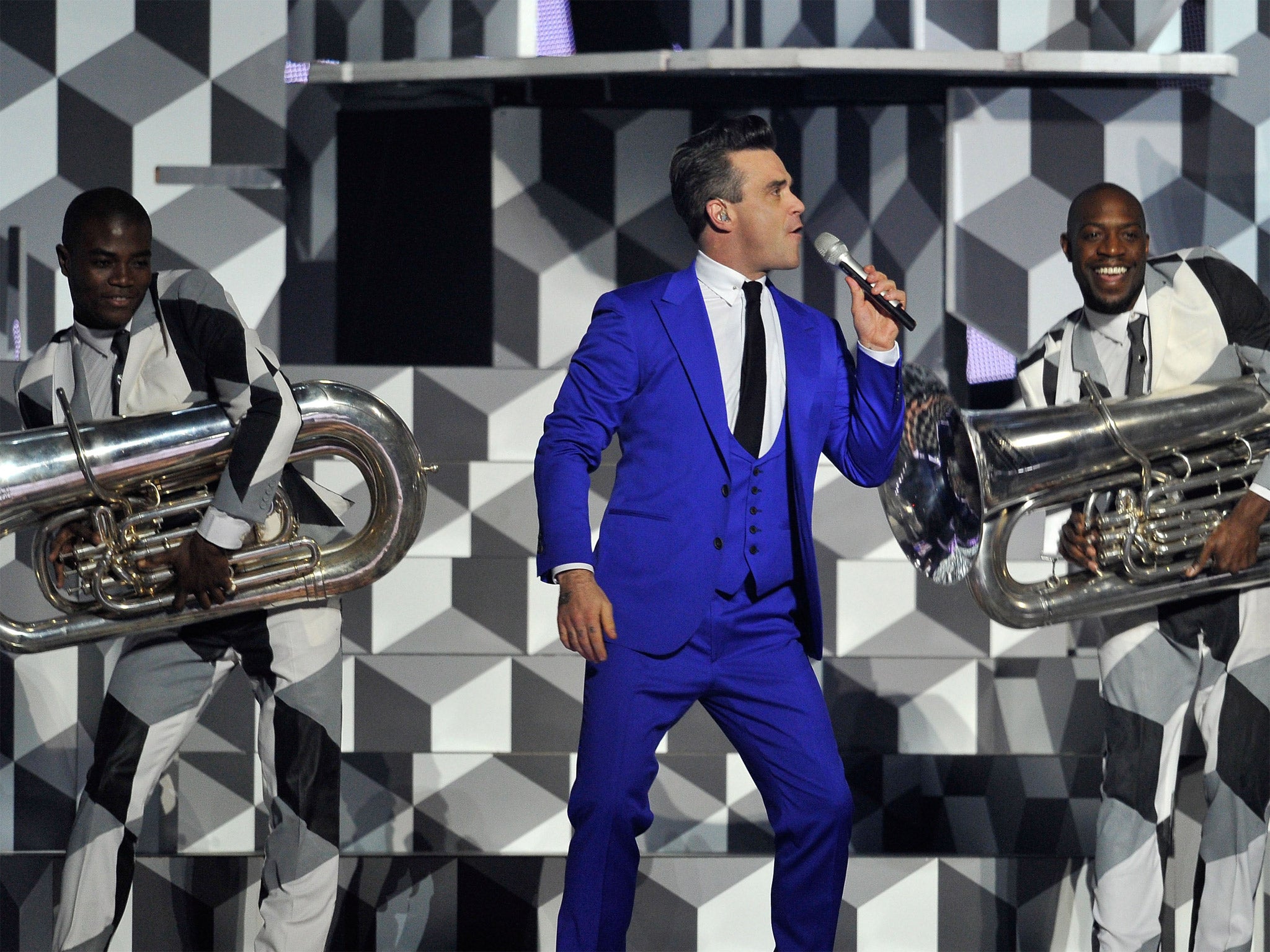 Robbie Williams performs on stage during the Brit Awards