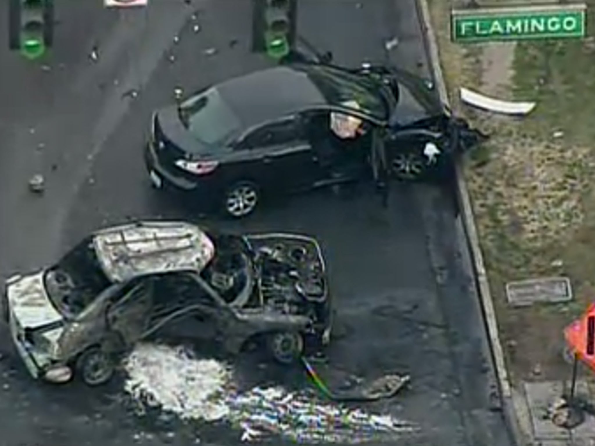 Two cars are seen in the aftermath of the shoot-out on Las Vegas Strip