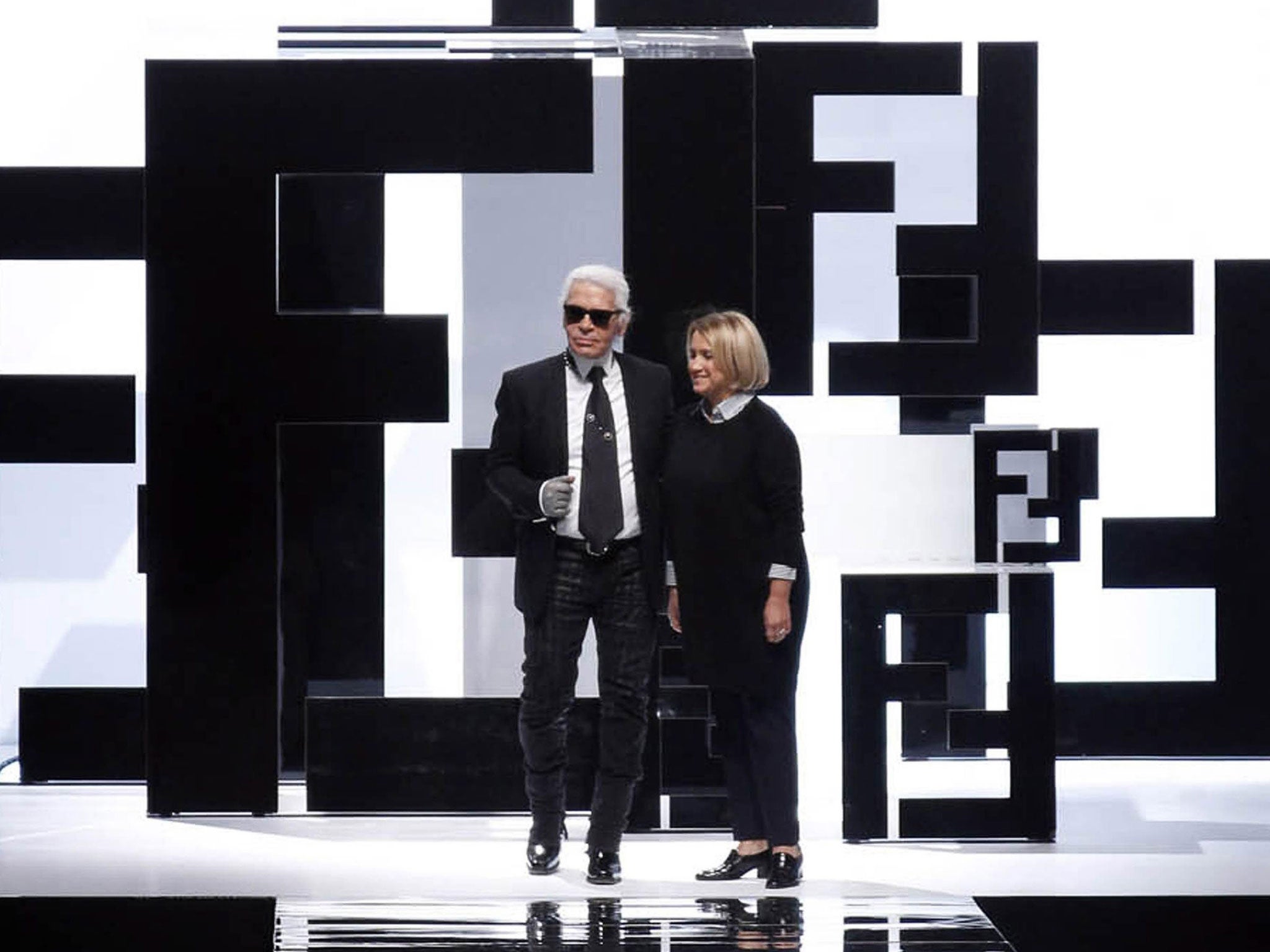 Karl Lagerfeld with Silvia Venturini Fendi at the Milan fashion show