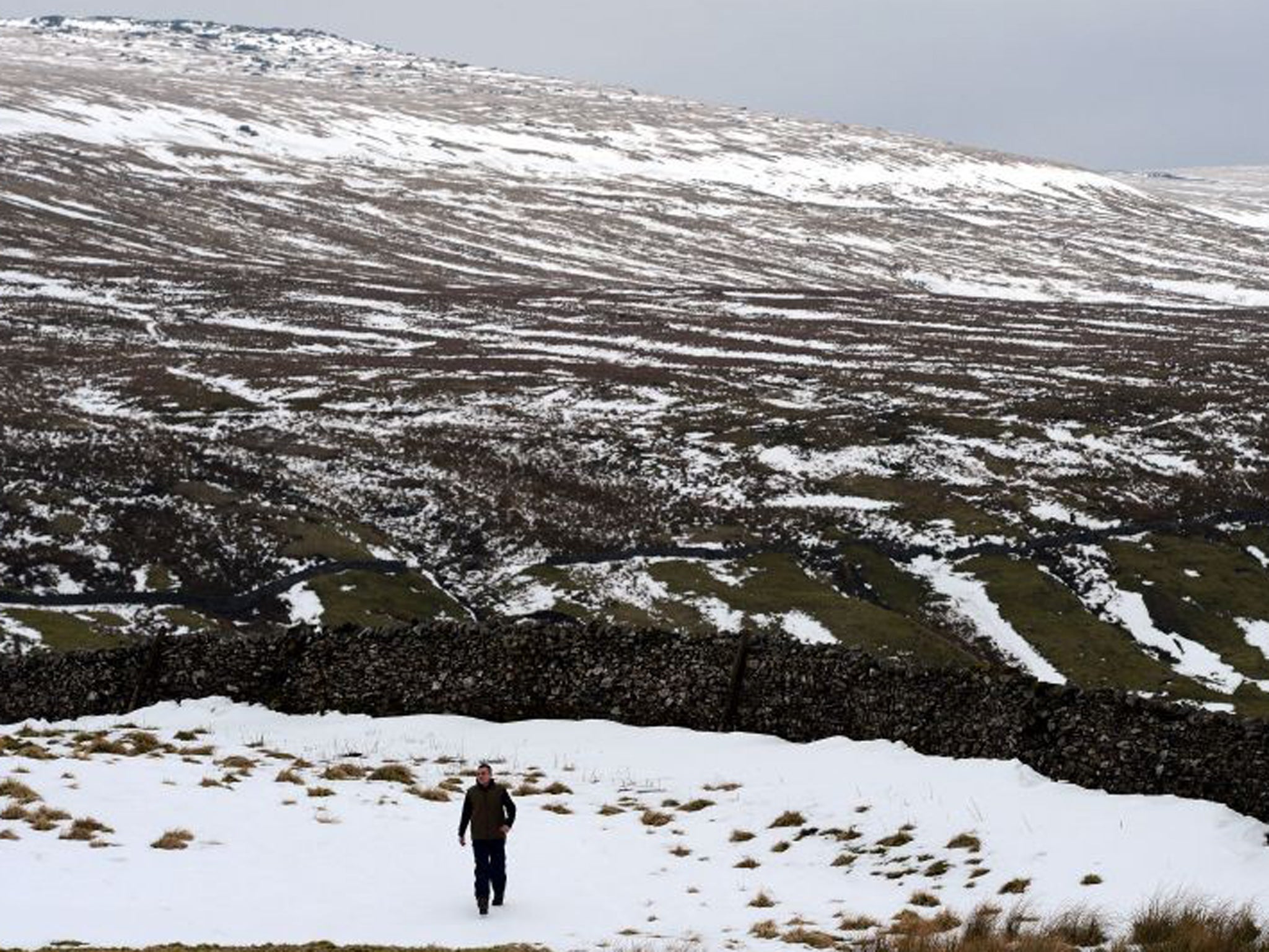 A dusting of snow covers the hill tops above Kettlewell near Skipton as the cold weather continues