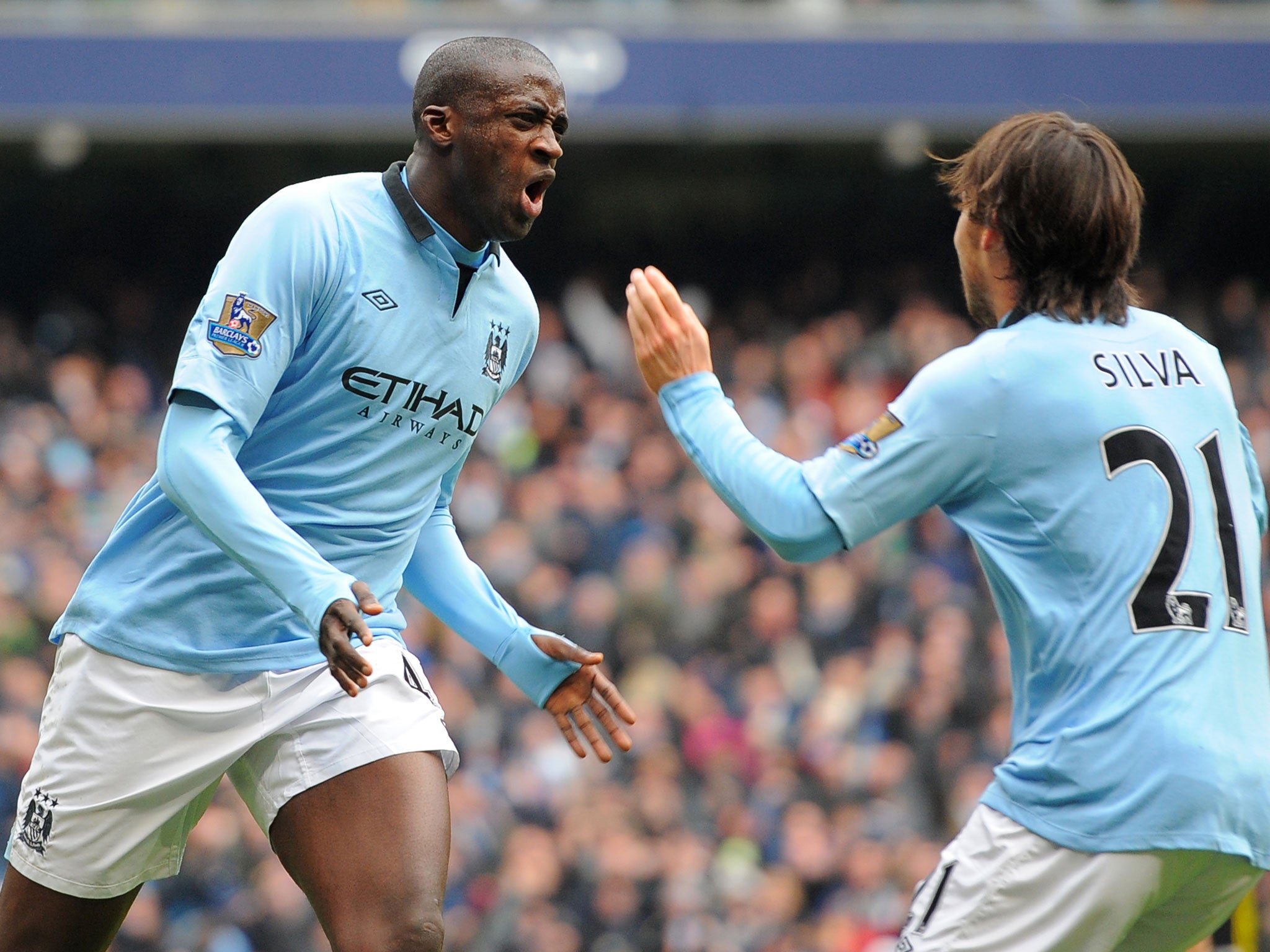 Yaya Toure celebrates his goal with David Silva